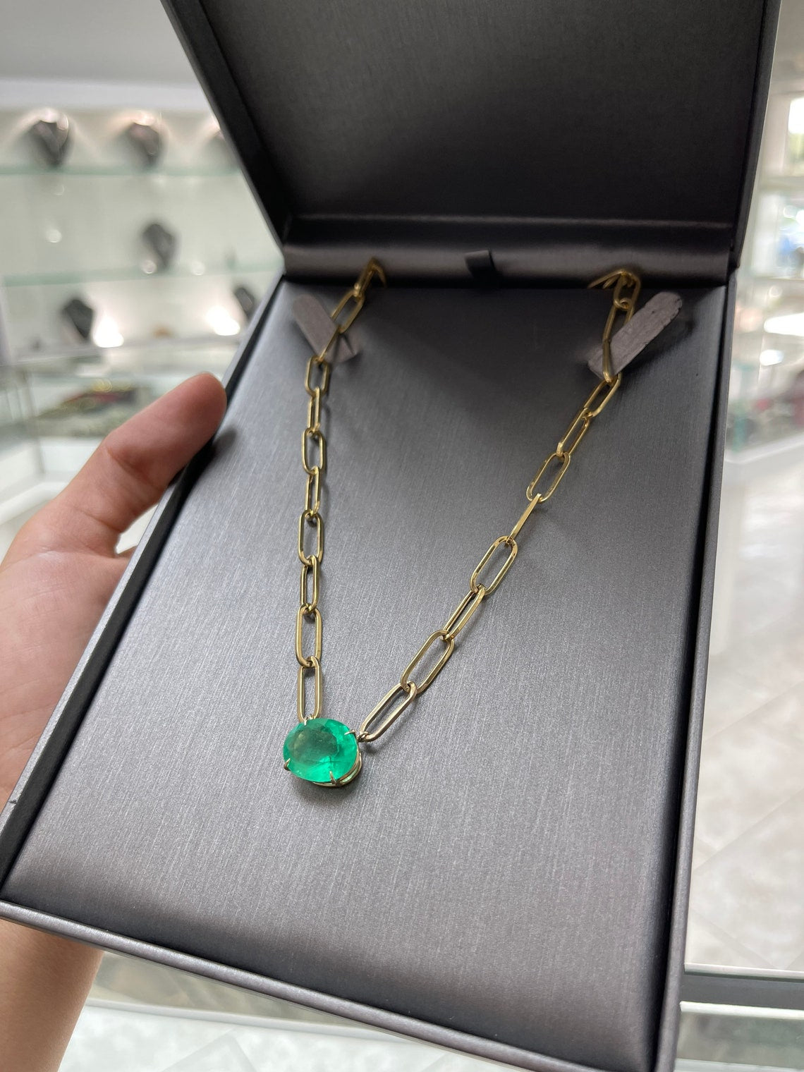 East to west oval emerald statement necklace 12.41 carat 14K