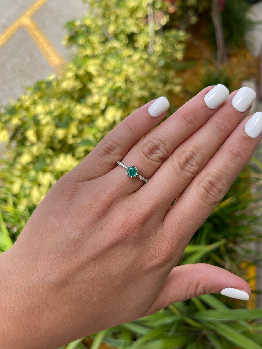 Emerald-Round Cut & Diamond Shank Engagement Ring on Hand