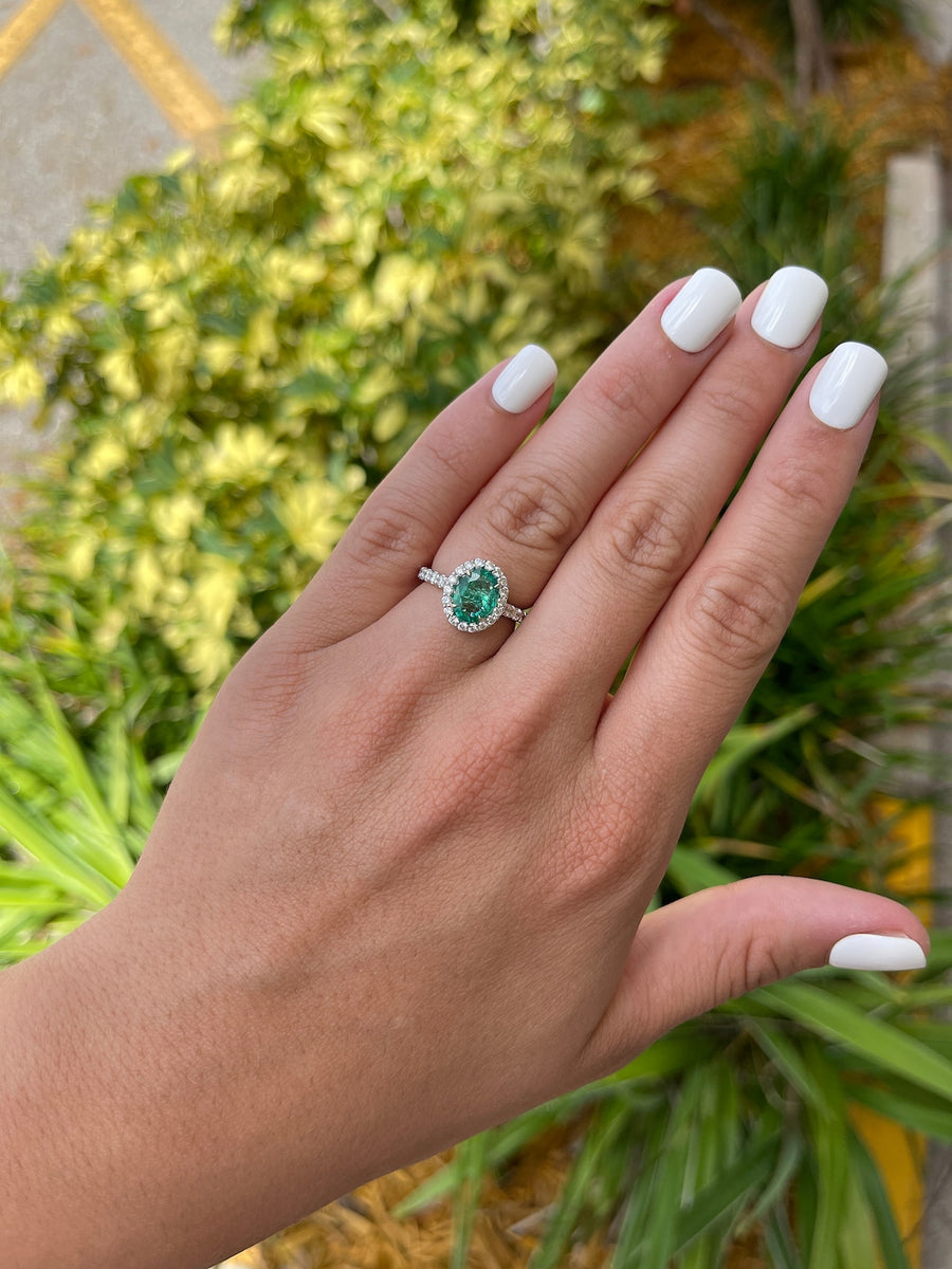 Emerald & Diamond Halo Engagement Ring on Hand