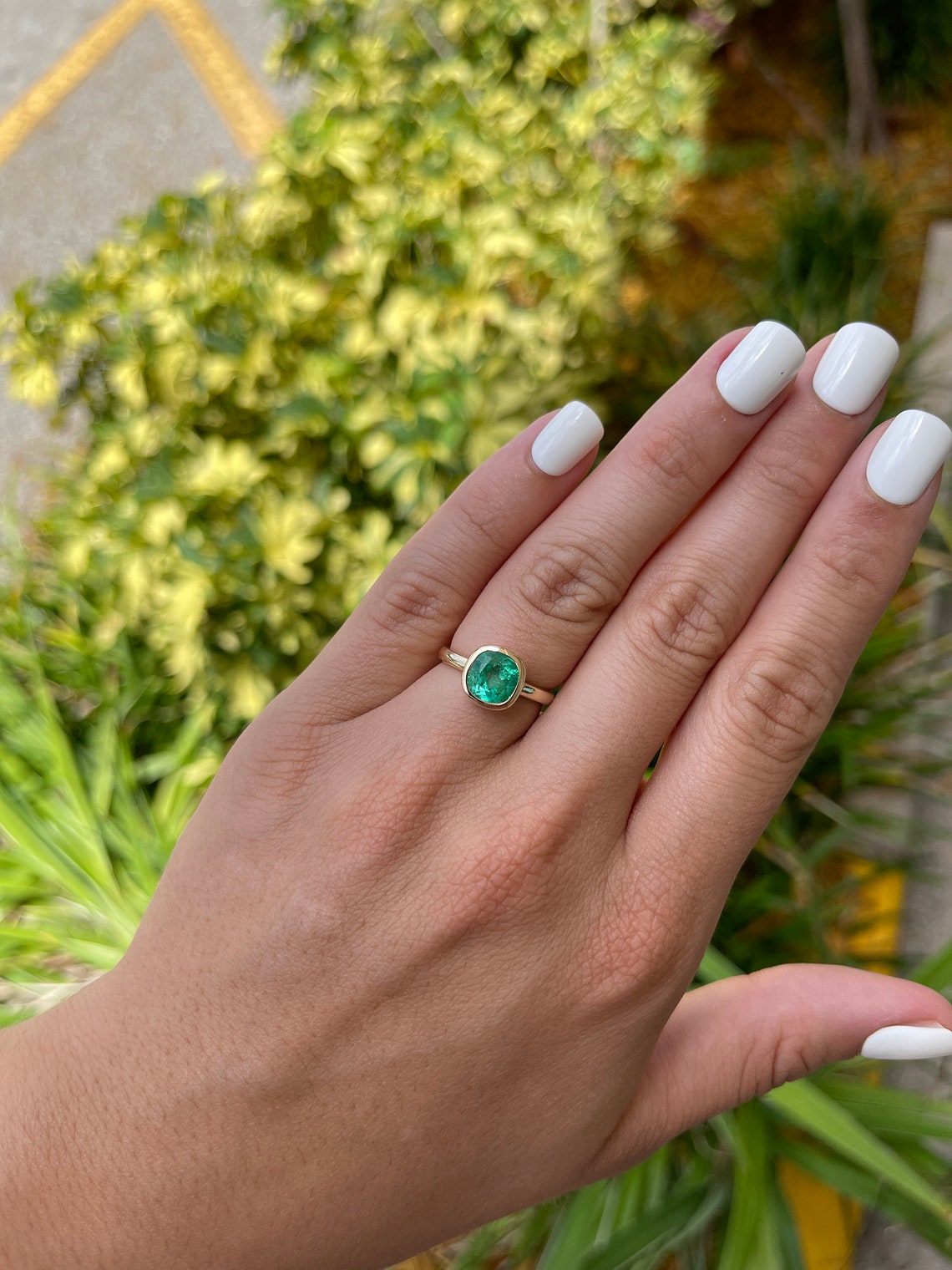 Cushion Cut Emerald Gold Ring on Hand