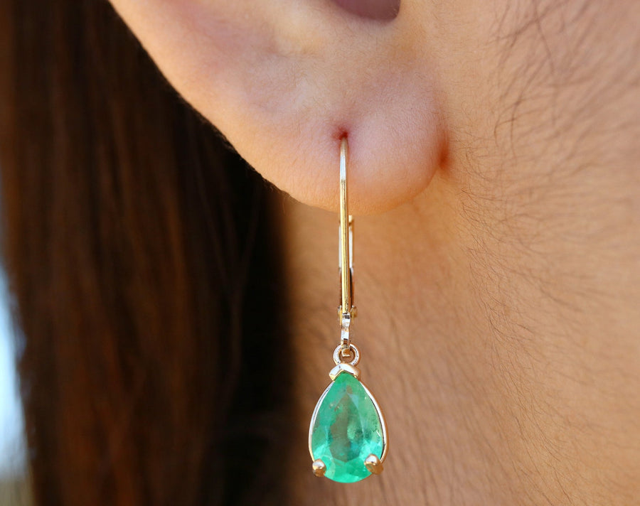 Natural Emerald Pear shaped leverback earrings in 14K on the ear