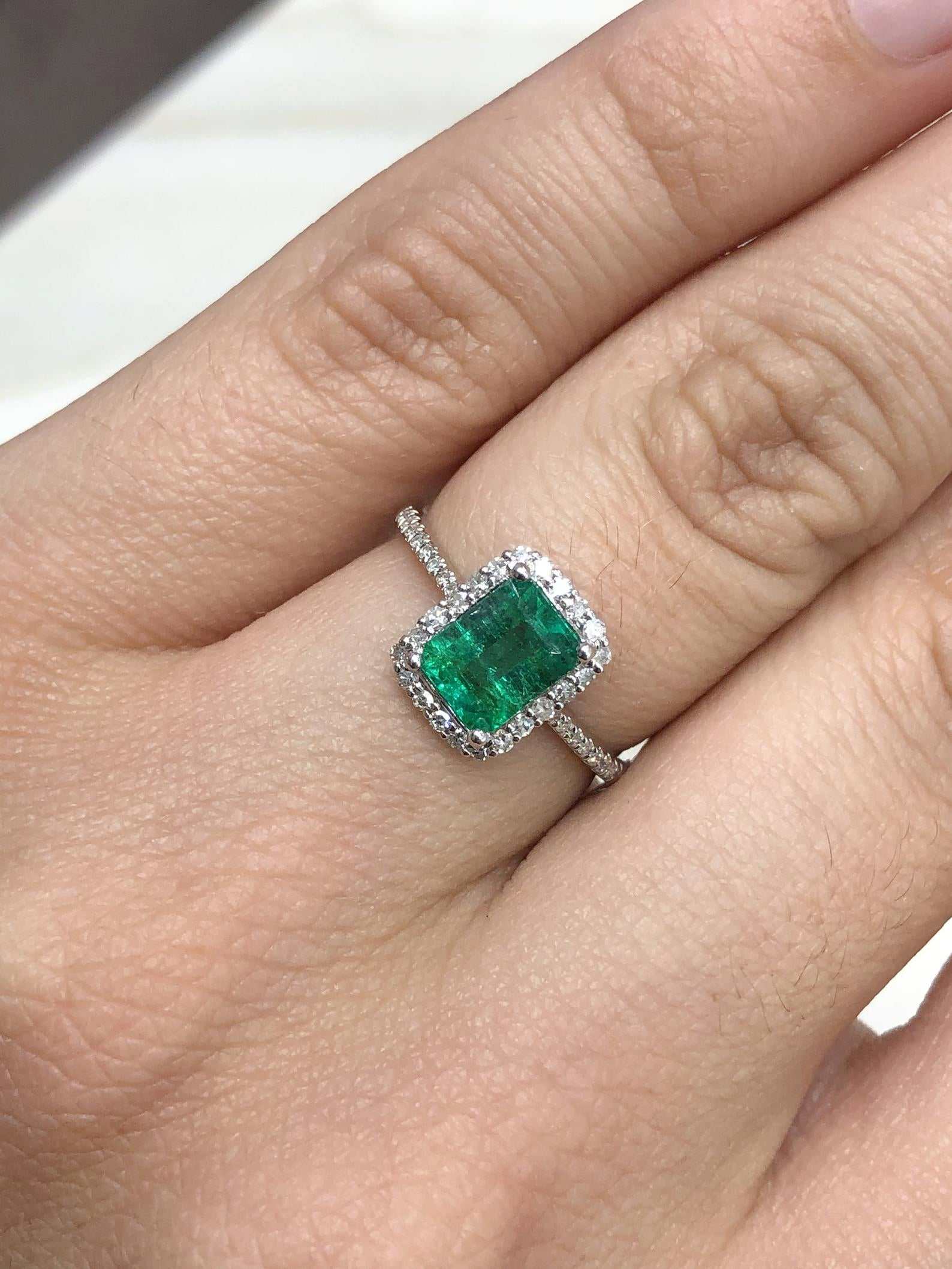 Celebrate Brilliance: 14K Gold Ring Featuring 1.70tcw Emerald Cut Emerald Halo