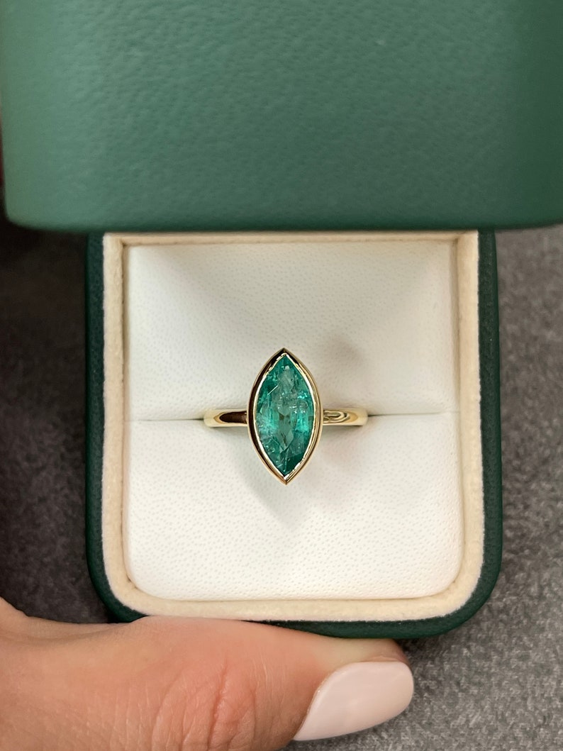 Emerald Marquise Cut Bezel Set  Solitaire Ring
