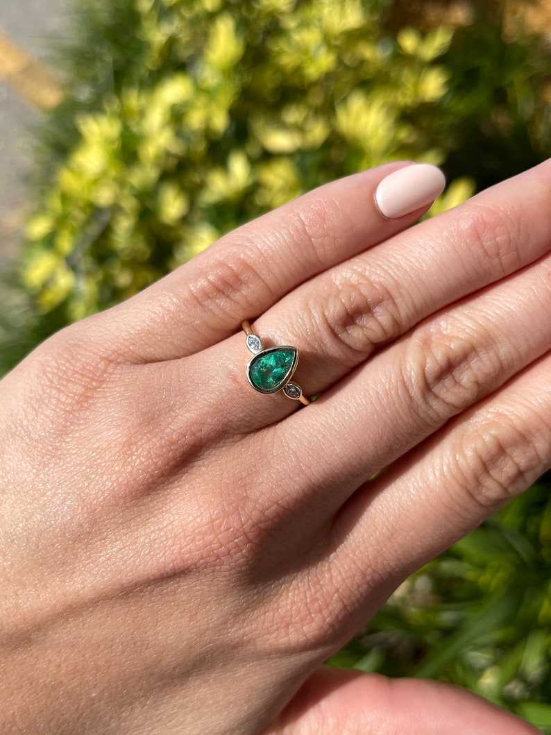 Bezel Set 1.17tcw Pear Natural Colombian emerald and Marquise Diamond Three Stone anniversary Ring 14K on hand