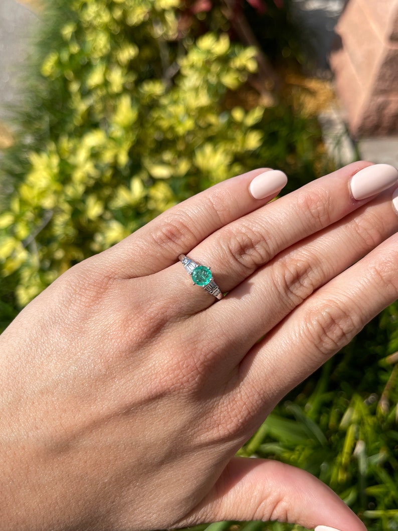 Celebrate Brilliance: 14K Gold Ring Featuring 1.10tcw Colombian Emerald Round Cut & Tapered Baguette