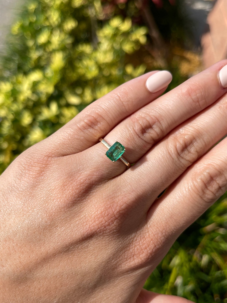 Celebrate Brilliance: 14K Gold Ring Featuring 1.05 Carat Emerald Solitaire
