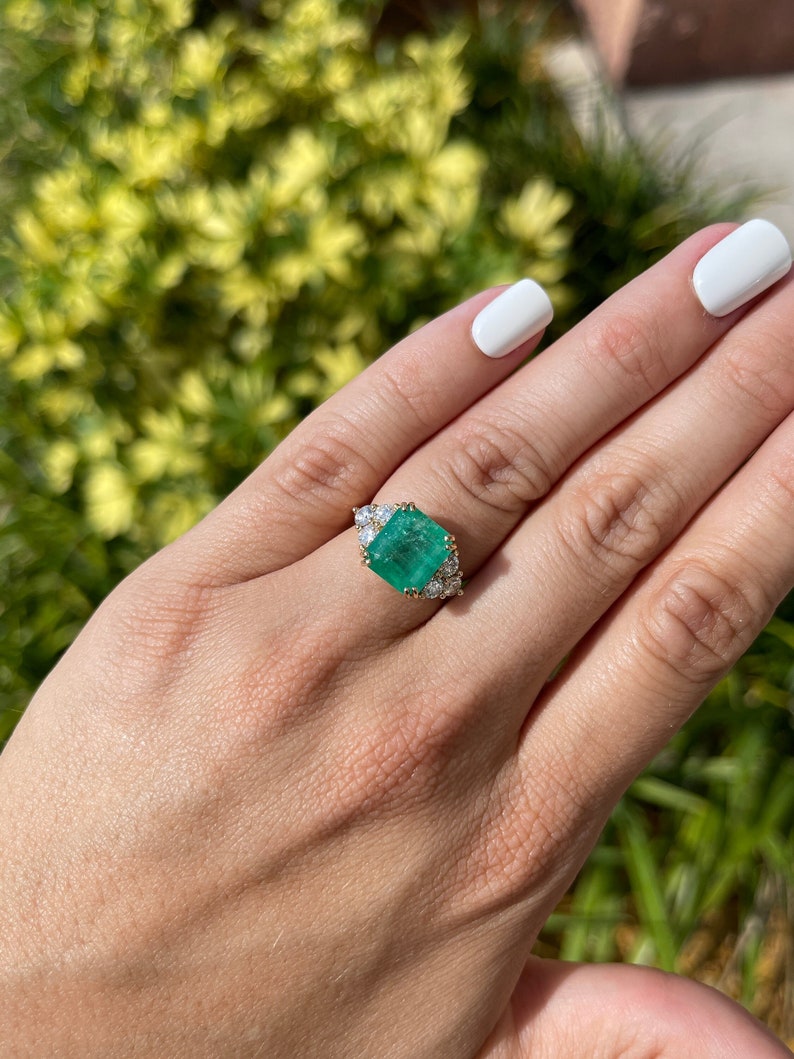 Colombian Emerald & Diamond Accent Three Stone Engagement Ring on Hand