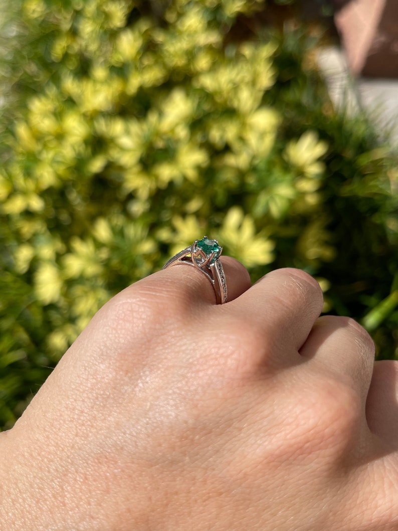 Classic Charm: Natural Emerald Oval Cut Diamond Accent 1.0tcw 18K Gold Engagement Ring