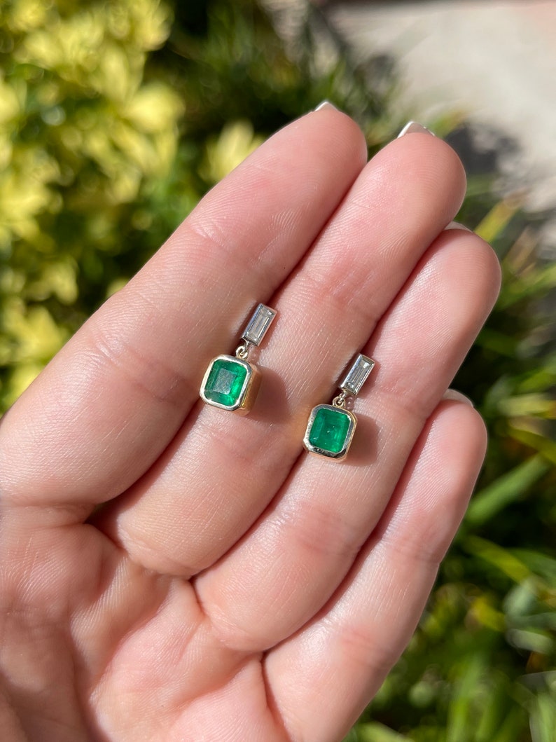 Emerald and Diamond Asscher Cut Dangle Earrings on Hand