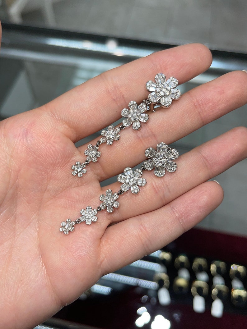 Brilliant Round & Baguette Cut Diamond Chandelier Statement Earrings on Hand