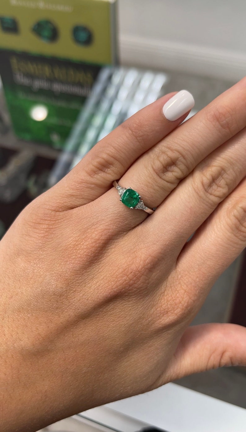 Colombian Emerald Cushion Cut Three Stone Diamond Ring on Hand