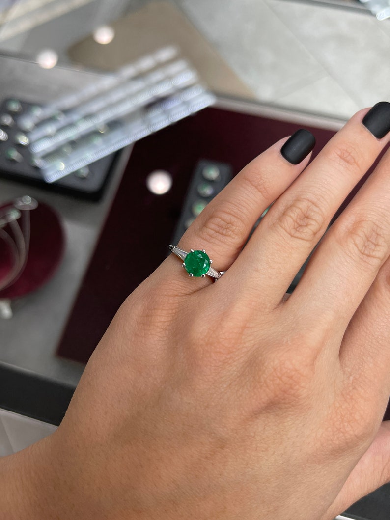 Emerald Round Cut & Tapered Baguette Diamond Three Stone Ring on Hand