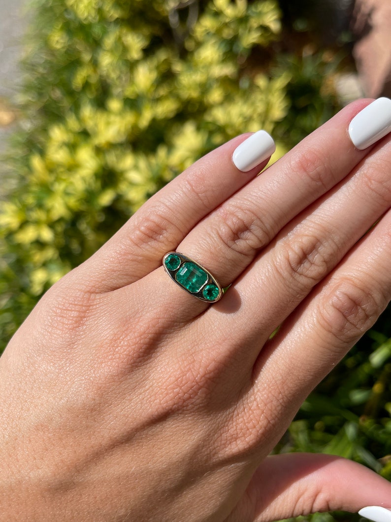 Colombian Emerald Round Cut Diamond Accent Three stone Ring on Hand