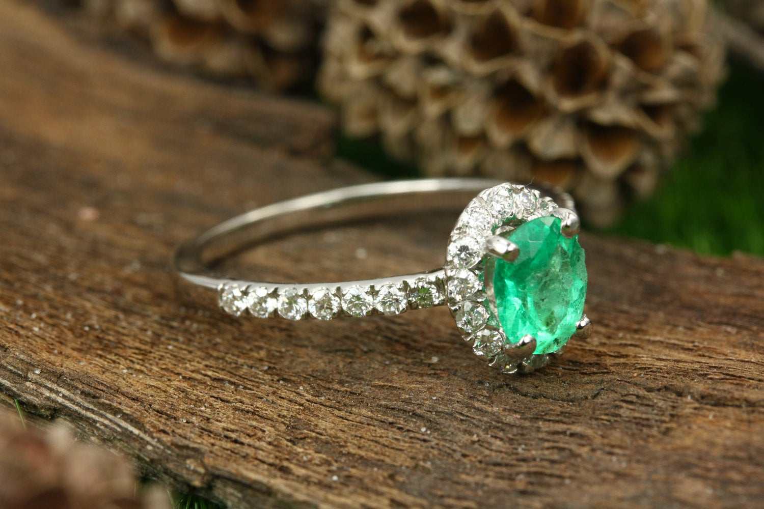 emerald and diamond halo with accent engagement ring white gold