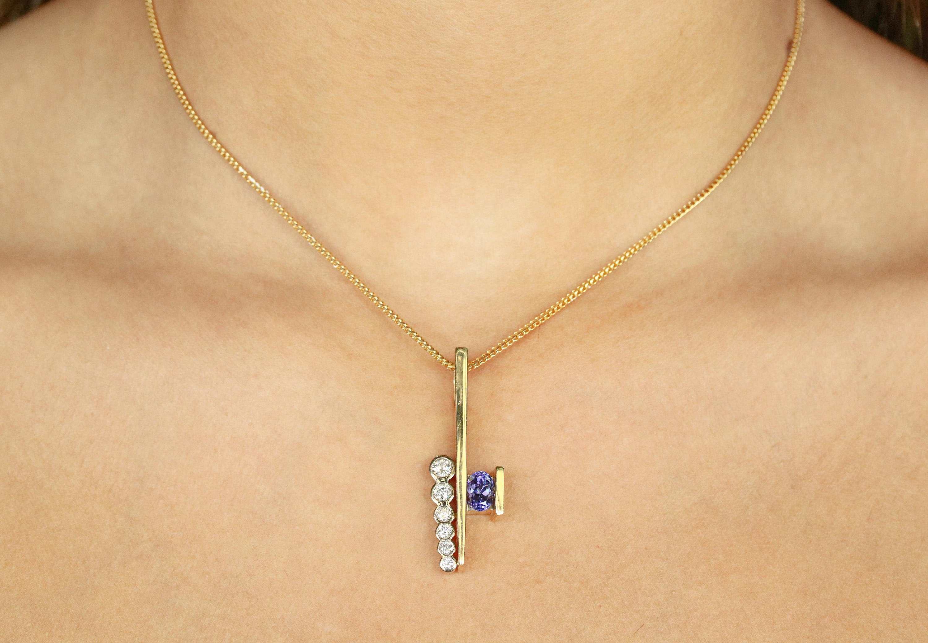 1.50tcw Tanzanite & Diamond Gold Pendant 