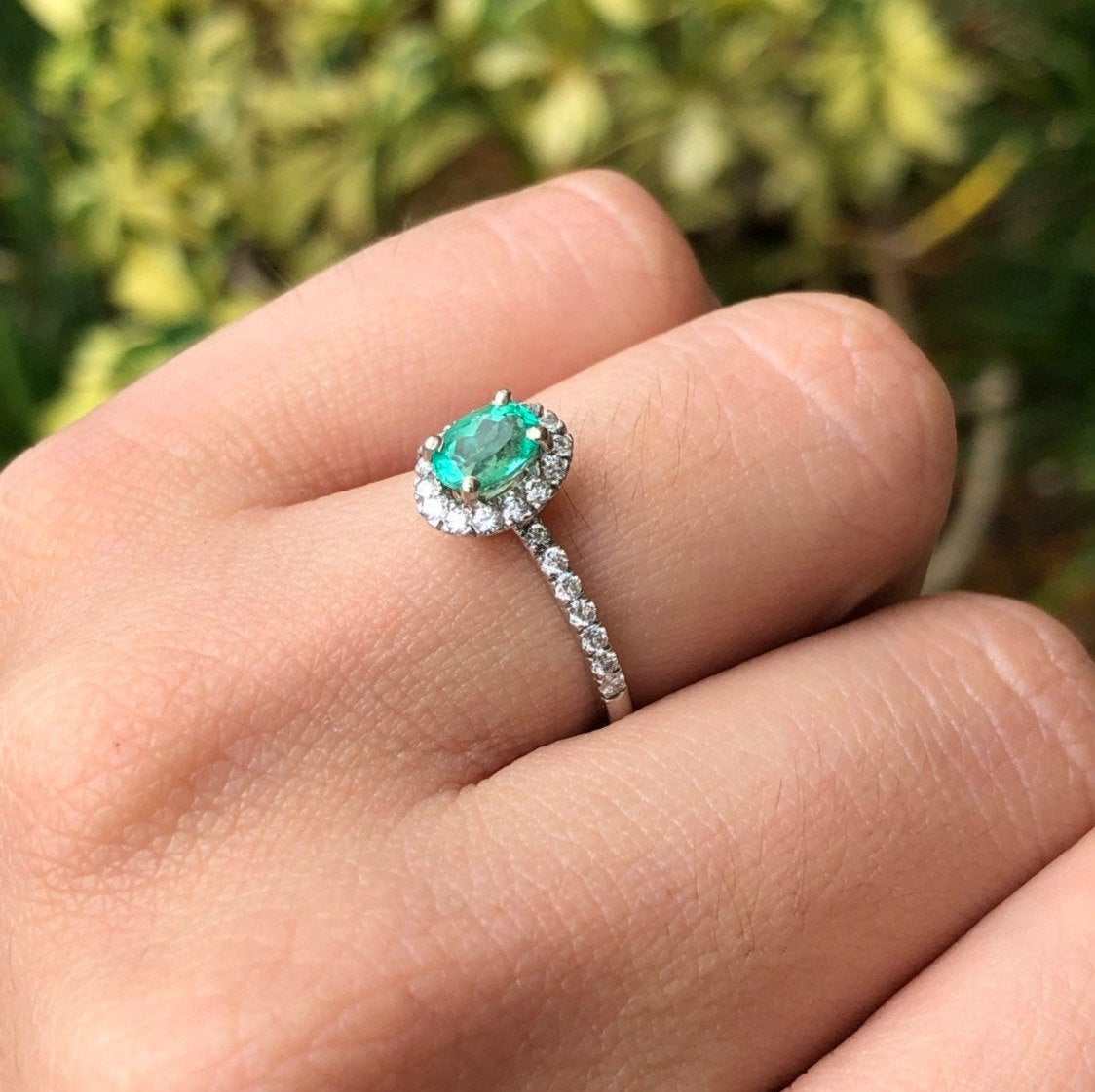 emerald and diamond halo with accent engagement ring white gold