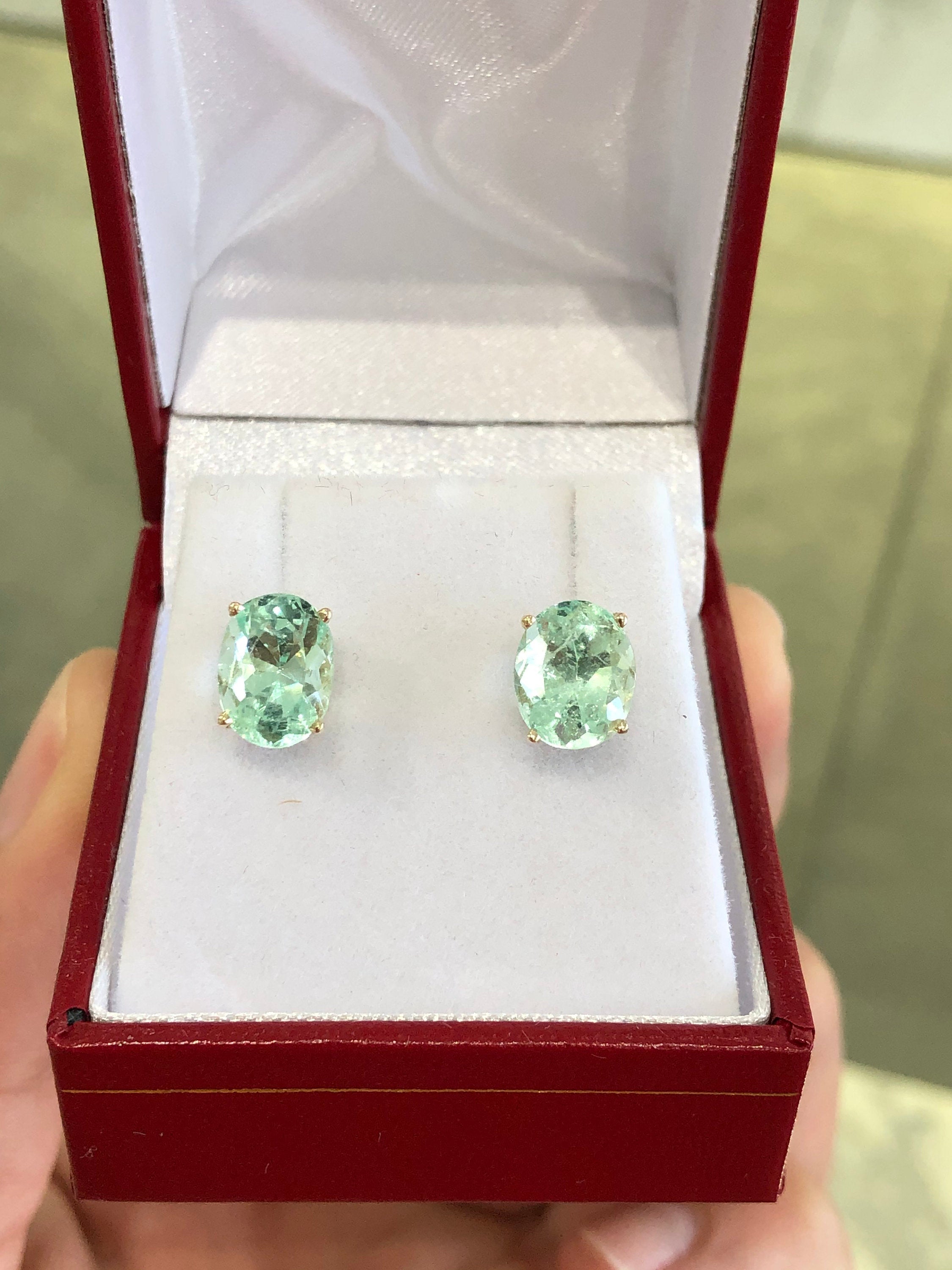 .09tcw Light Green Emerald Oval Cut Stud