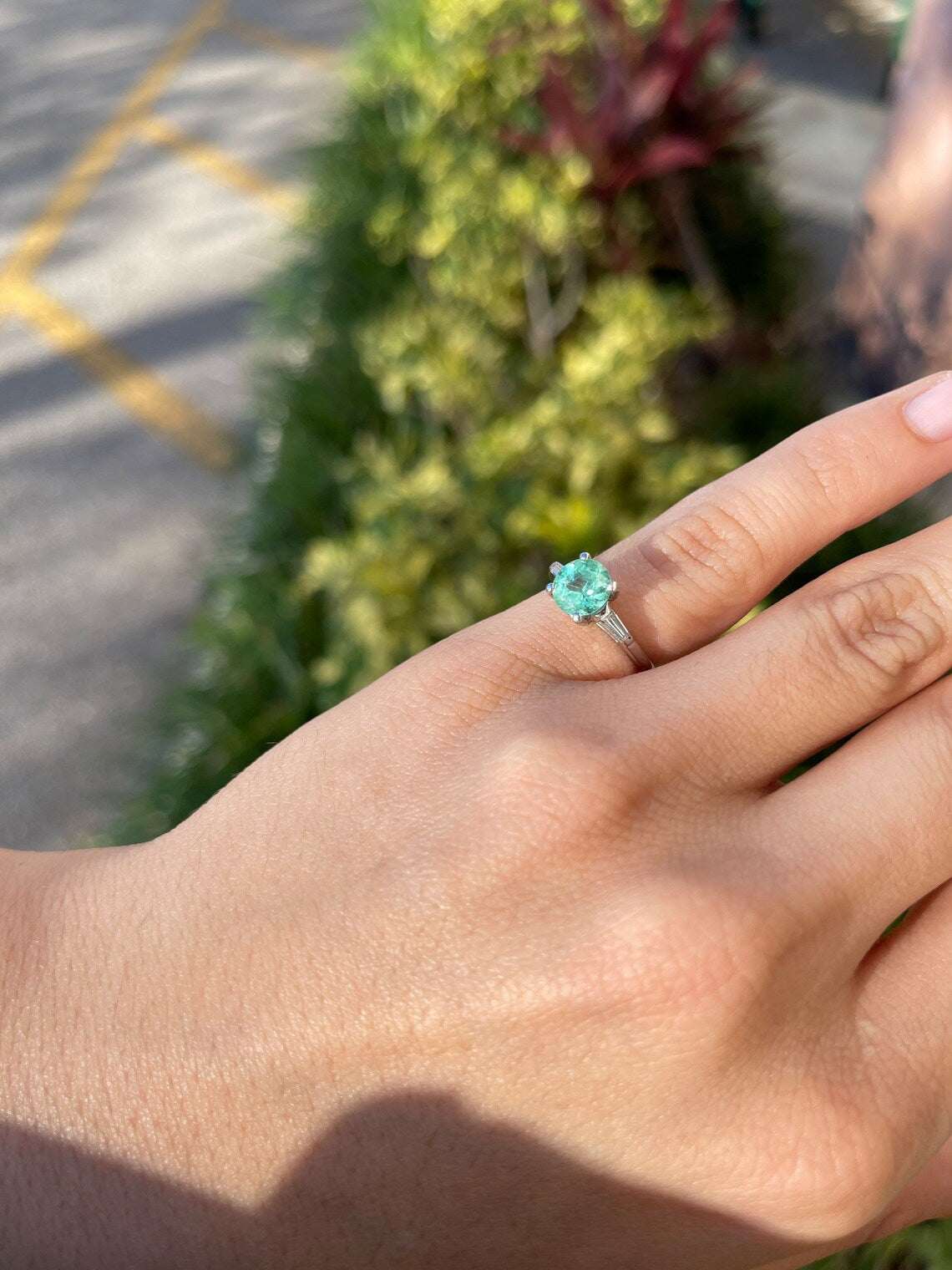 Three stone platinum engagement ring with round and baguette cut diamonds totaling 1.70 carats from JR Colombian Emeralds.