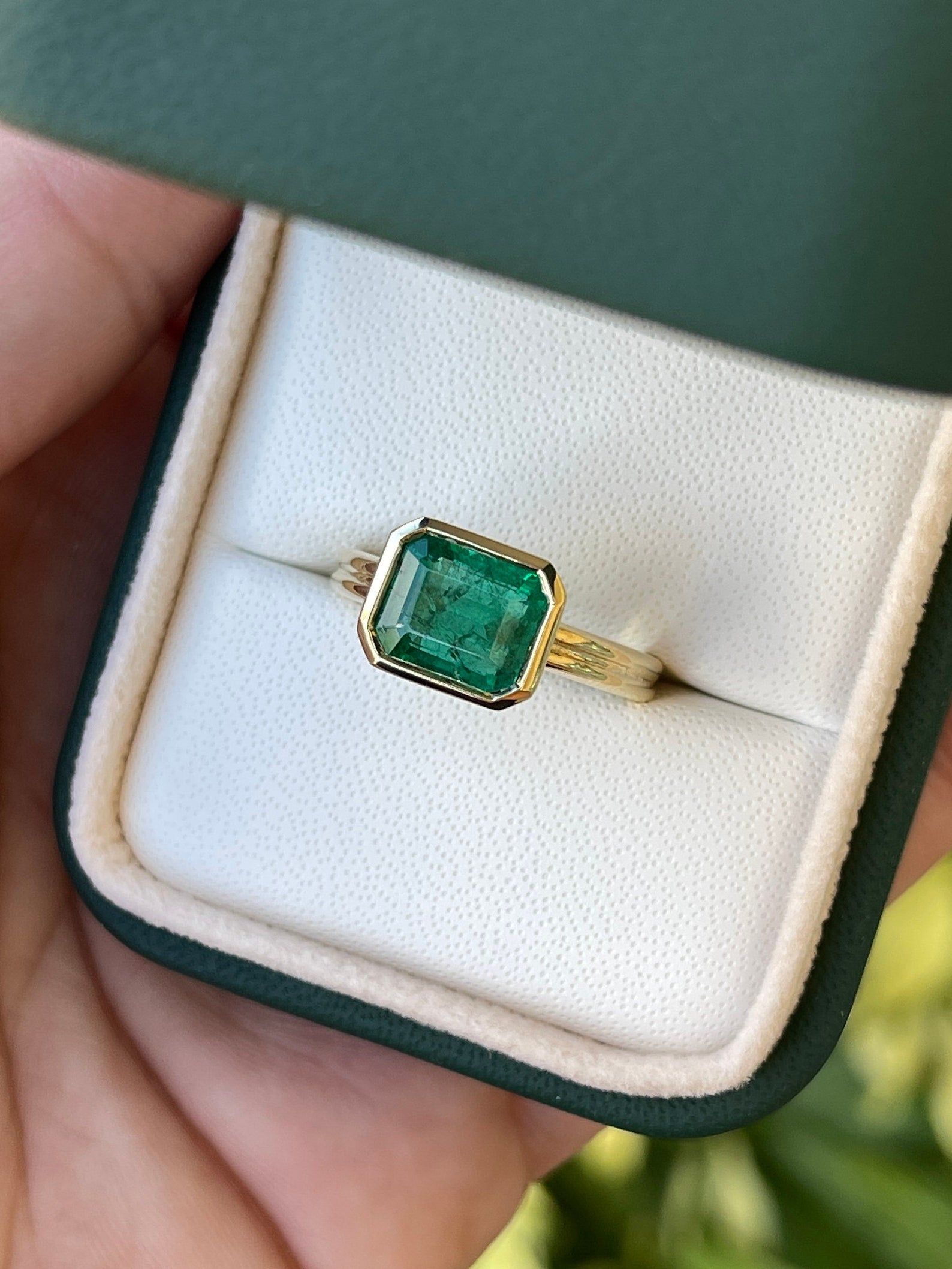 Natural 2.75ct east-to-west dark vivid green emerald bezel solitaire ring in 18K gold by JR Colombian Emeralds