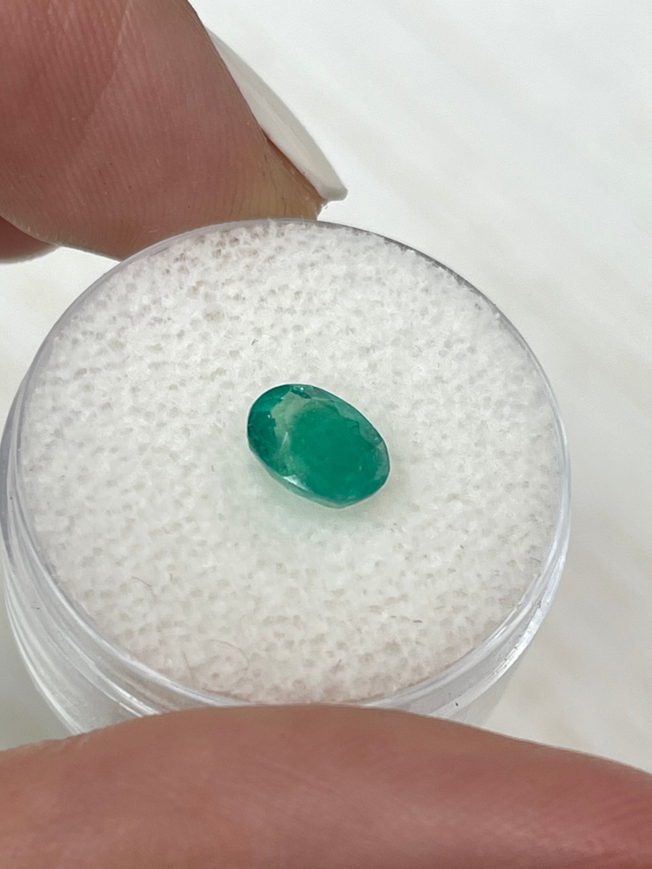 Oval cut 1.19 carat semi-transparent rich green Colombian emerald, natural loose gemstone by JR Colombian Emeralds.