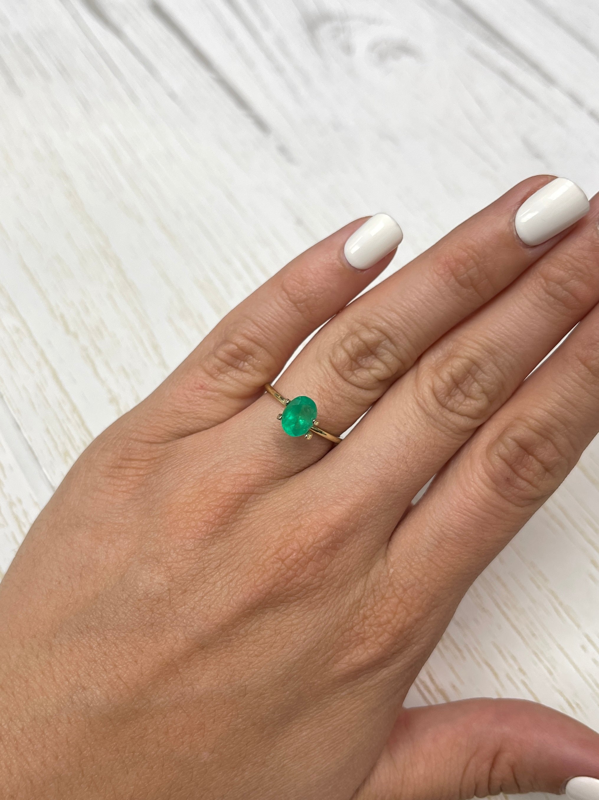 Bright 1.40 Carat Apple Green Colombian Emerald loose oval cut gemstone from JR Colombian Emeralds.