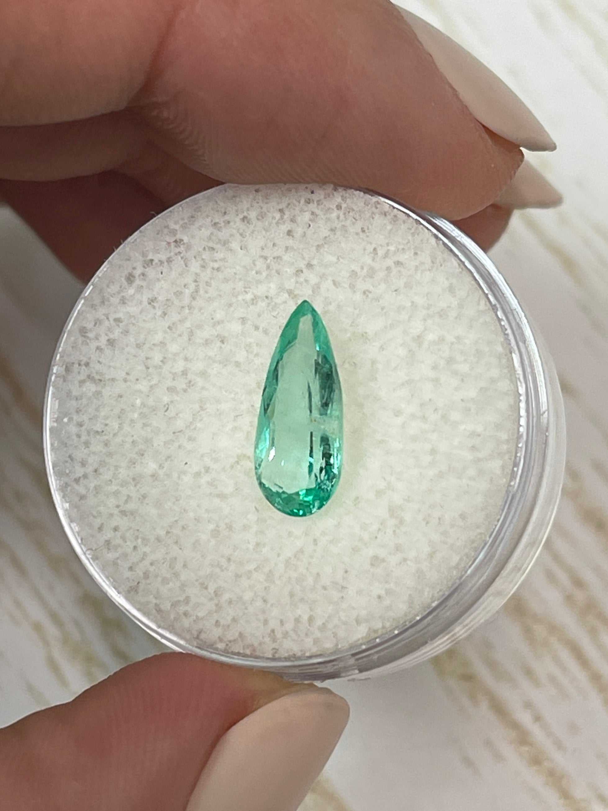 1.49 carat slender green natural Colombian emerald loose pear cut gemstone from JR Colombian Emeralds.
