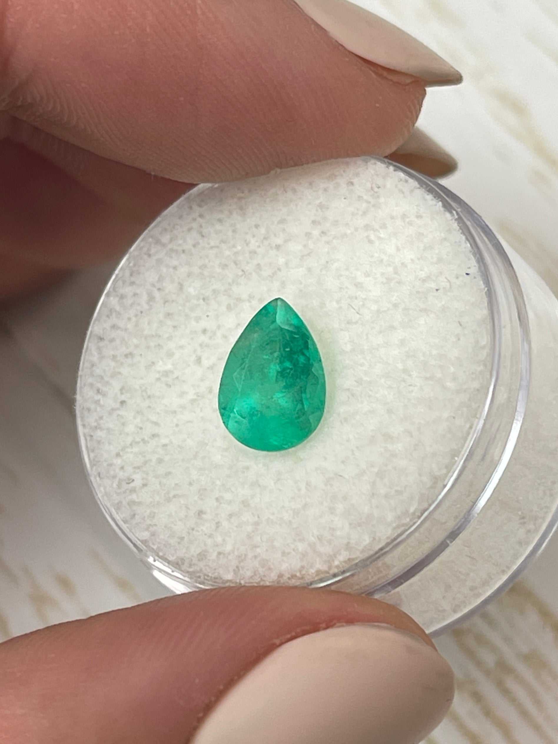 1.58 carat medium green natural Colombian emerald loose pear cut gemstone from JR Colombian Emeralds.
