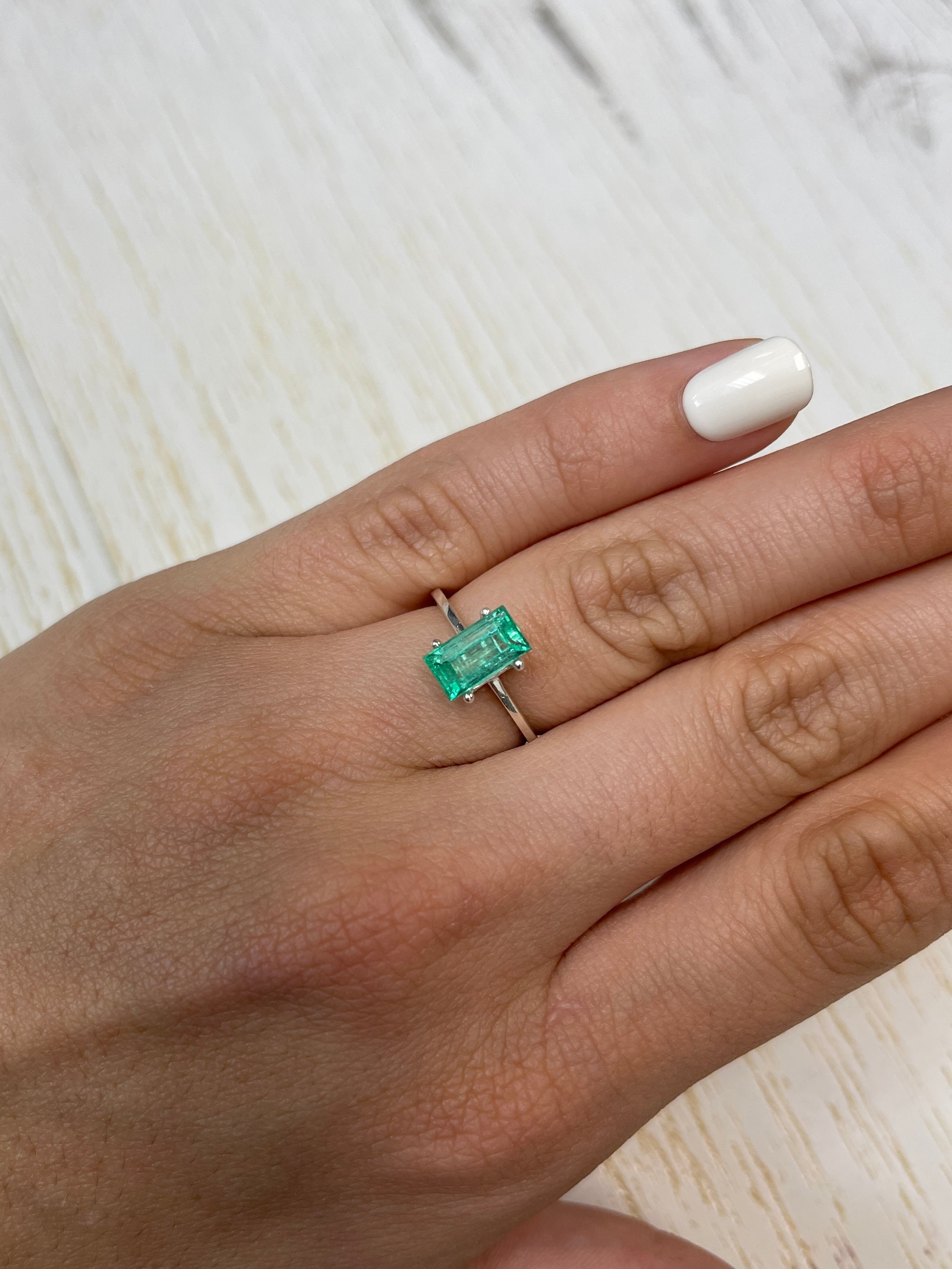 Natural 1.72 carat Colombian emerald baguette from JR Colombian Emeralds, vibrant green, rectangular cut, loose gemstone.