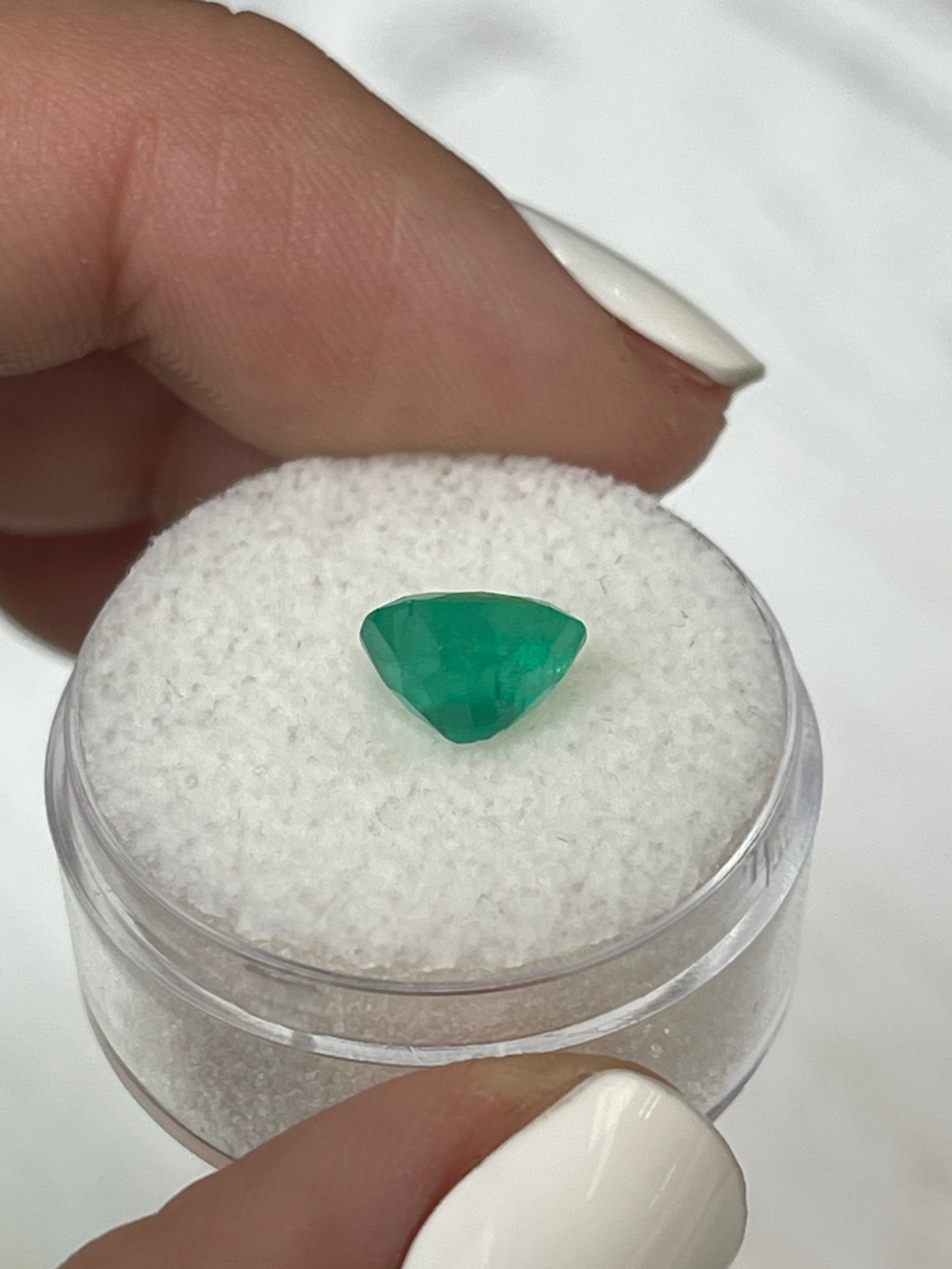 Natural oval cut Colombian emerald gemstone, 1.76 carats with chunky medium green color from JR Colombian Emeralds.