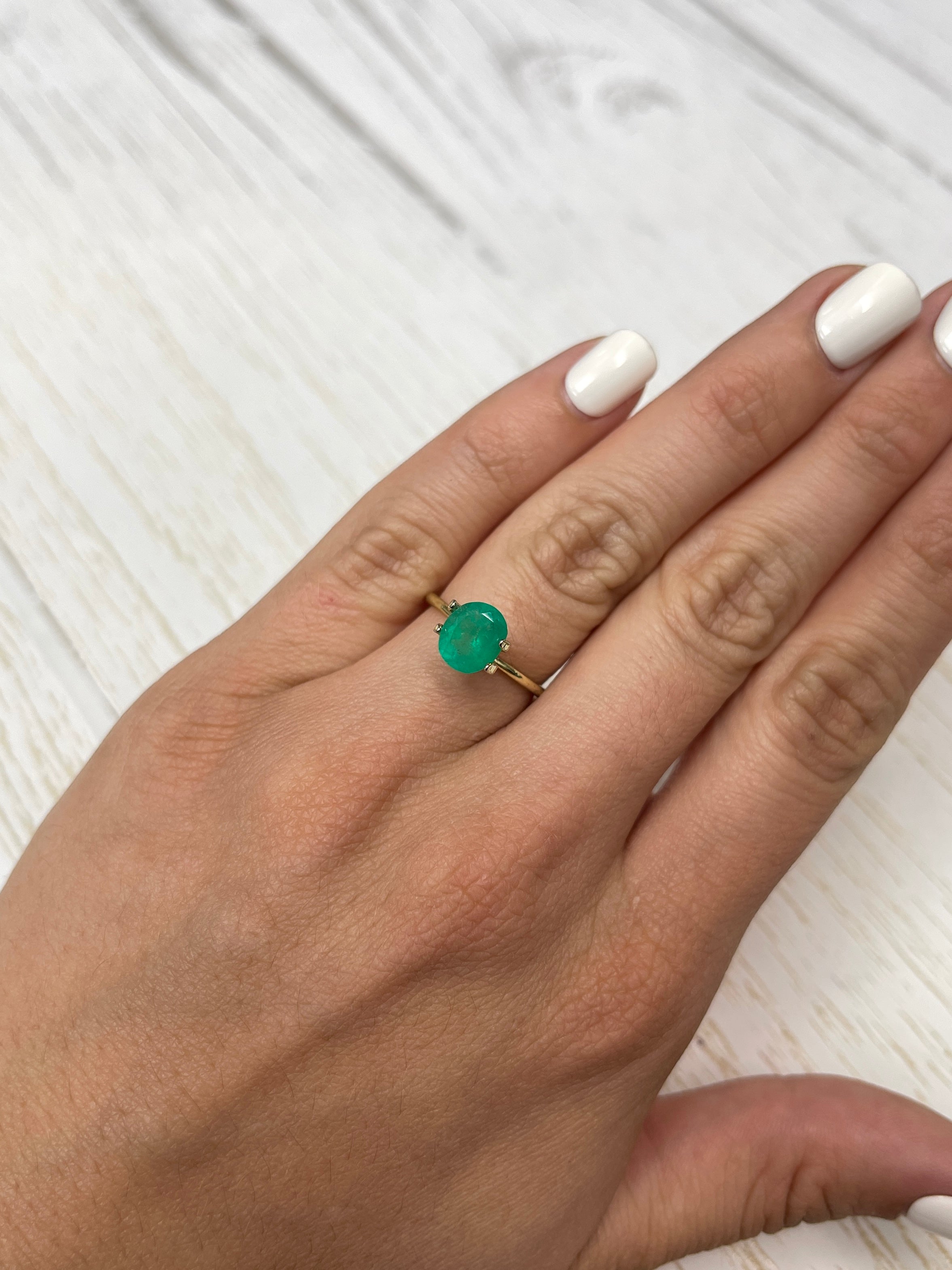 Natural 1.76 carat green Colombian emerald loose stone, oval cut, medium chunky size from JR Colombian Emeralds.