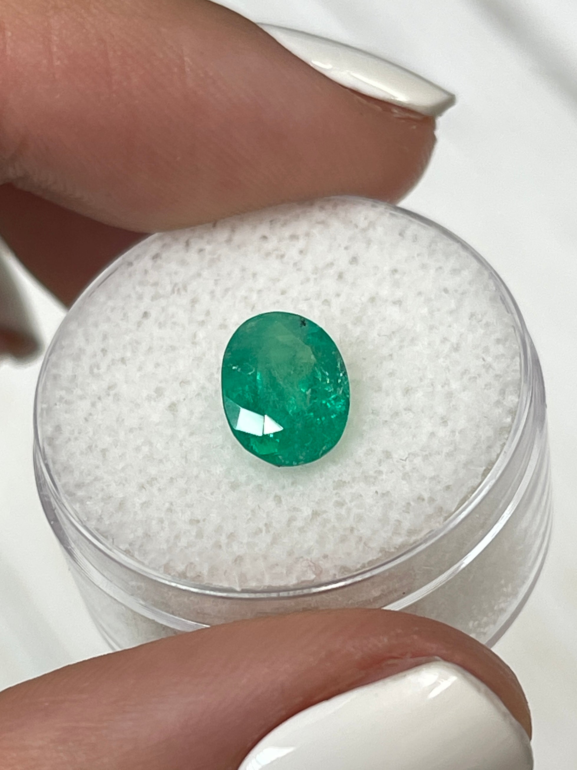 Oval-cut 1.87 carat medium green natural Colombian emerald gemstone from JR Colombian Emeralds.