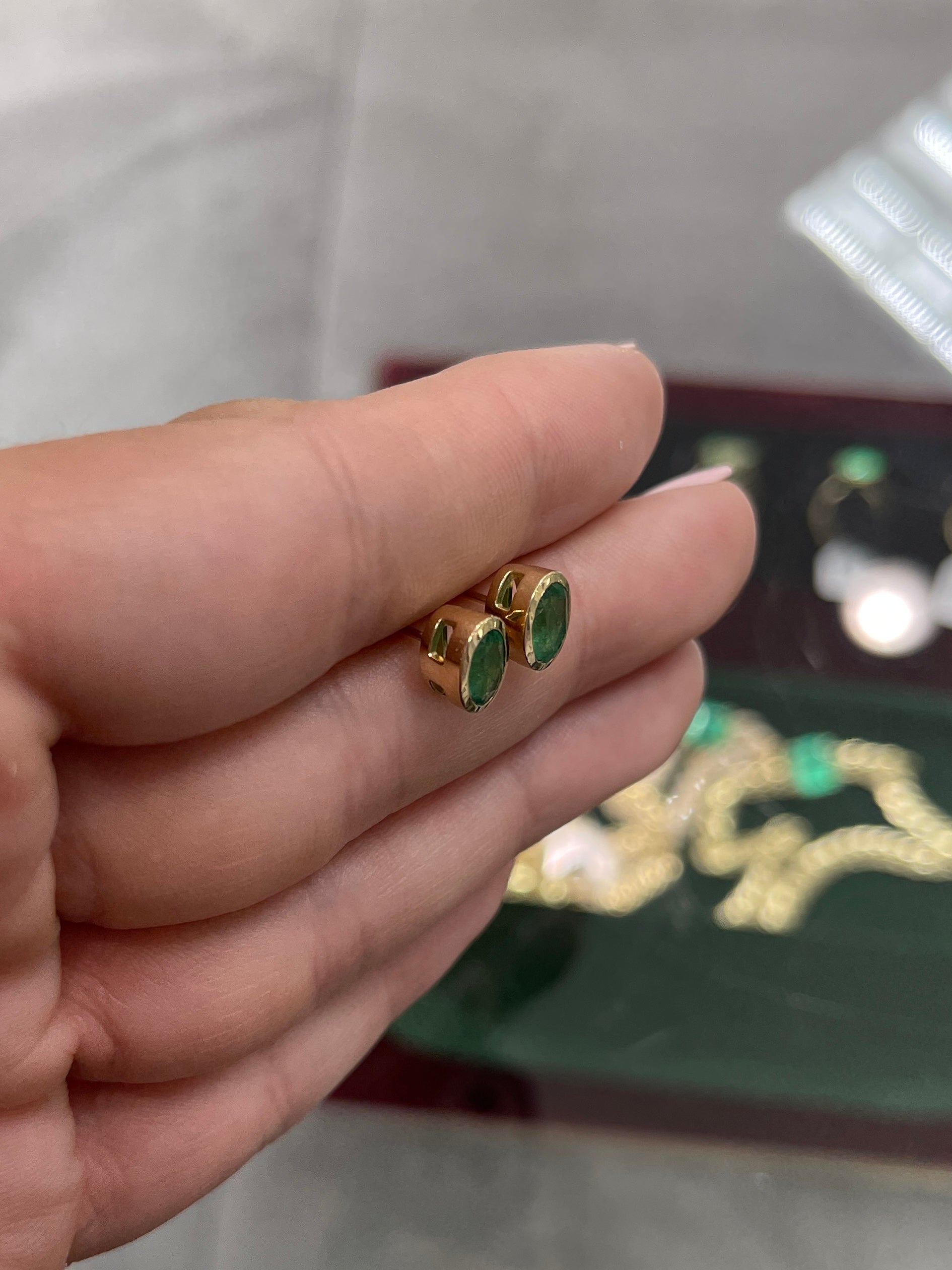 14K gold stud earrings with 1.87 carats of oval-cut natural emeralds, bezel set, by JR Colombian Emeralds.
