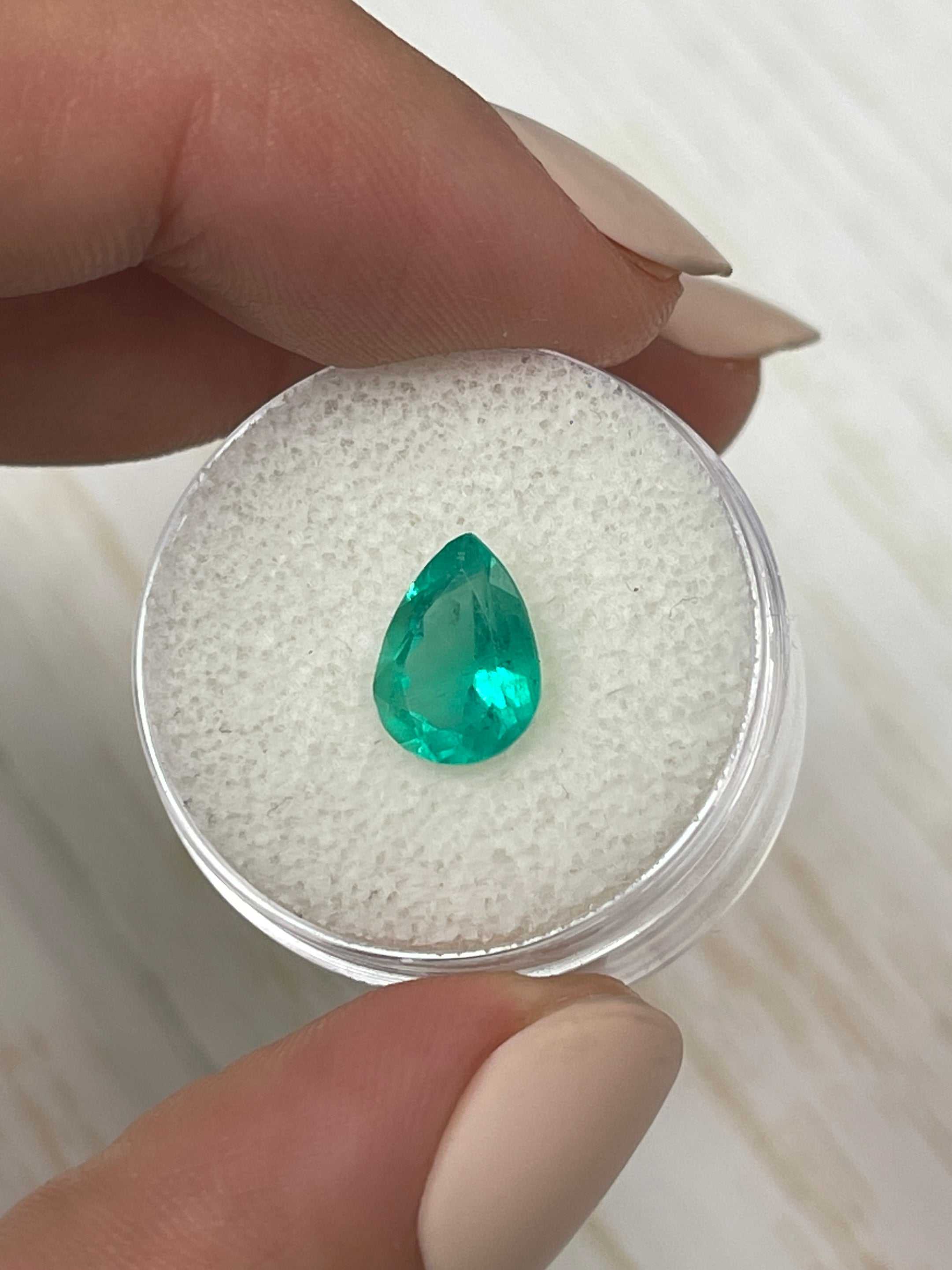 1.88 Carat chunky green natural Colombian emerald in pear cut, loose gemstone from JR Colombian Emeralds showcasing vibrant color and clarity.