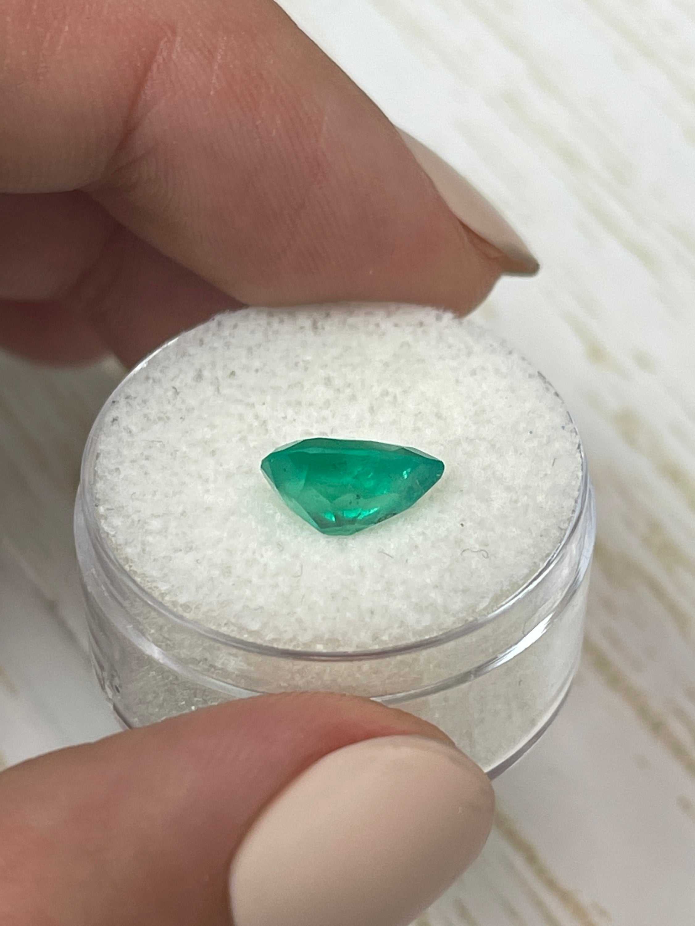 Natural 1.88 carat chunky green Colombian emerald loose gemstone in pear cut, showcasing vibrant color and clarity.