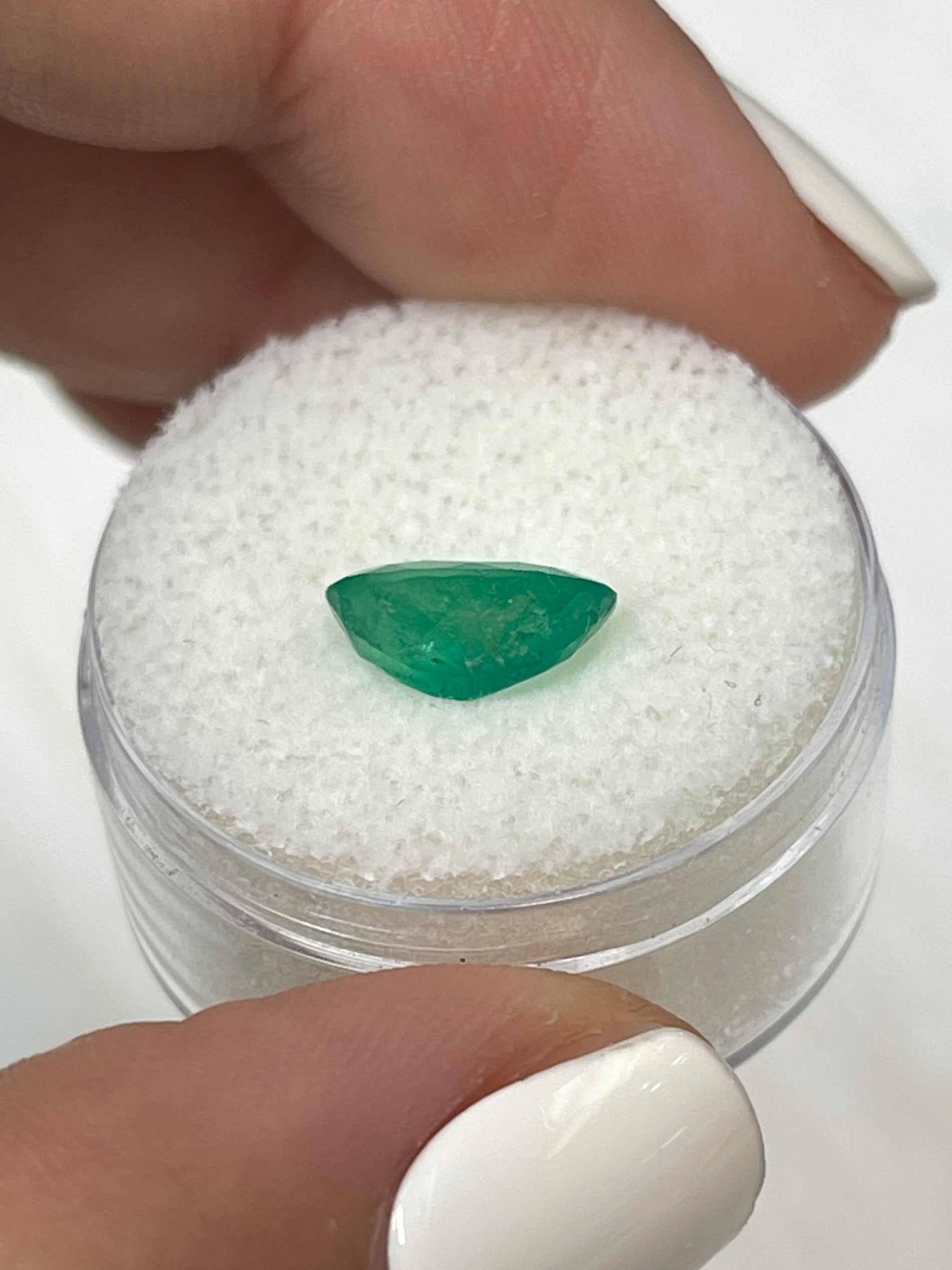 Oval cut 1.94 carat green natural Colombian emerald from JR Colombian Emeralds, loose gemstone with vibrant green color.