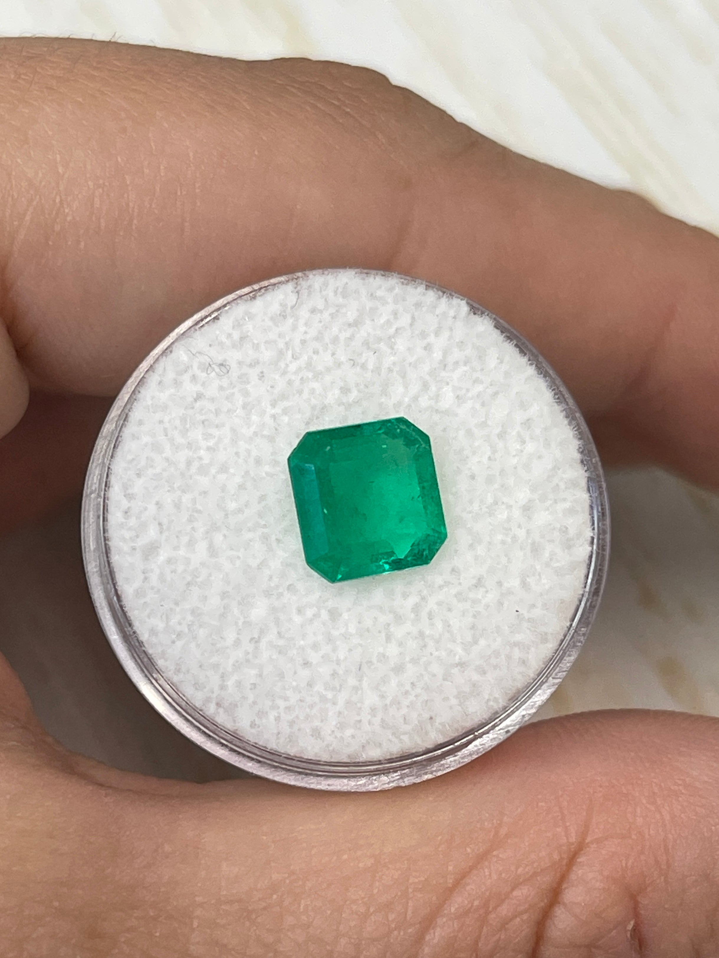 Natural 1.97 carat Muzo green Colombian emerald loose Asscher cut with 8.5x8.5 mm size, vibrant and transparent gemstone.