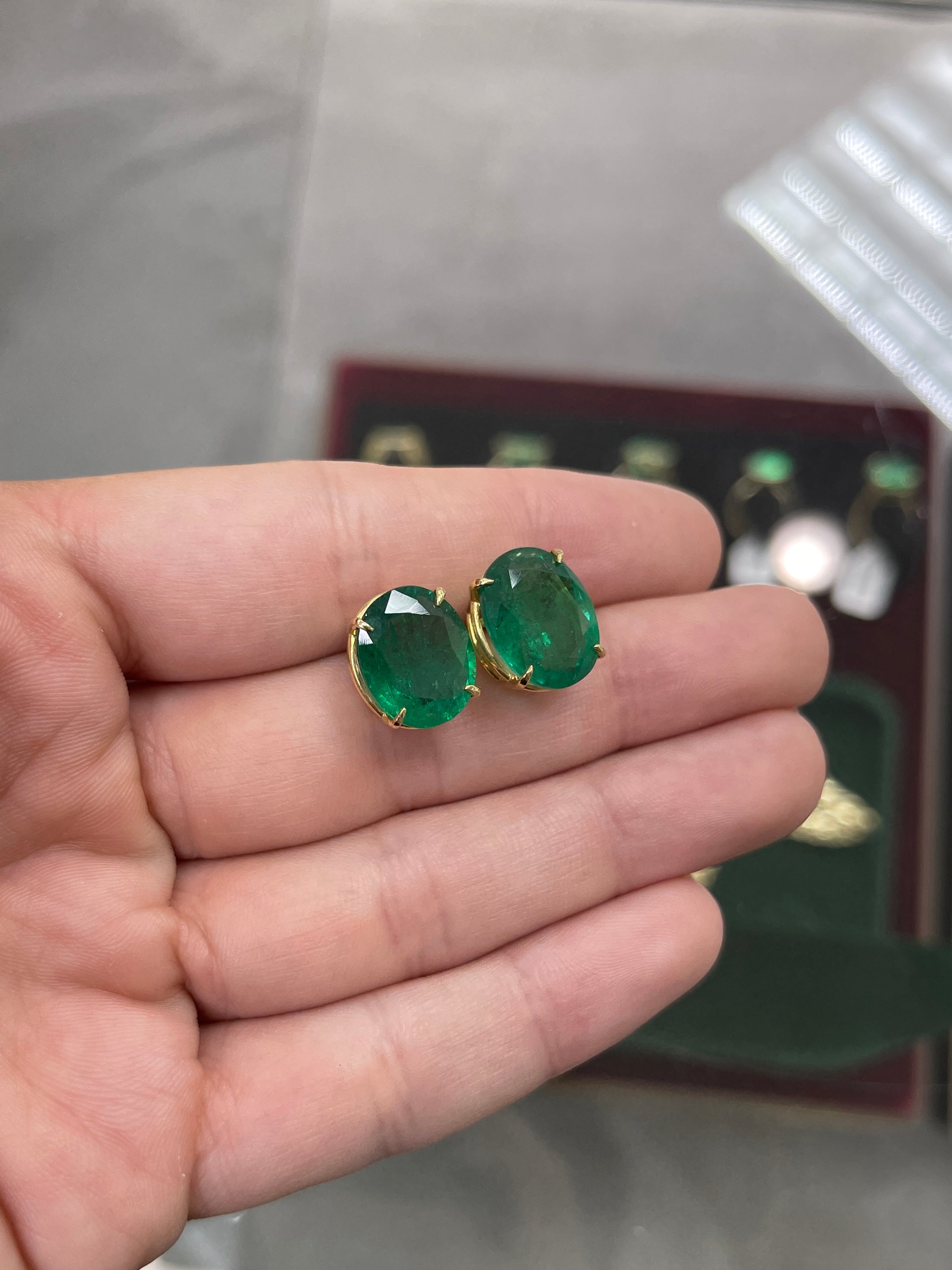 Dark green Zambian oval stud earrings with 13.61tcw AAA quality, set in 18K gold by JR Colombian Emeralds.