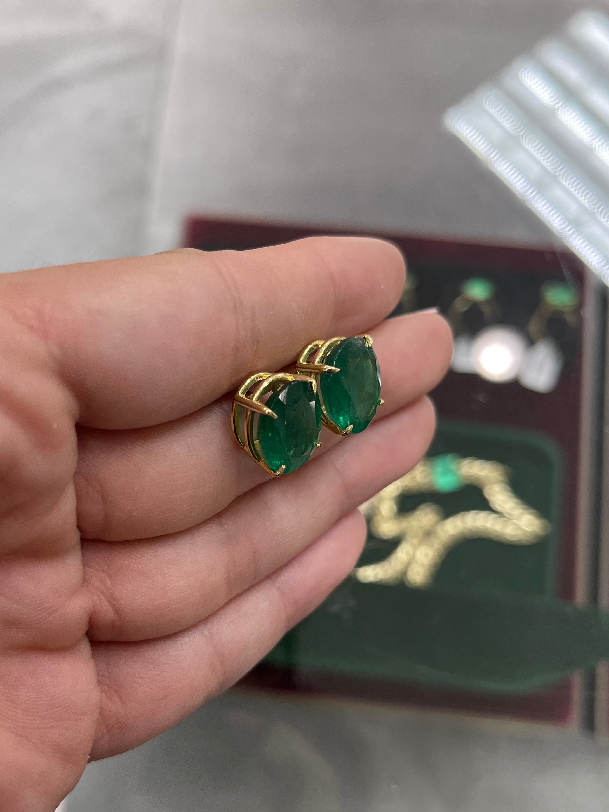 Dark green Zambian oval stud earrings with AAA quality, 13.61 tcw, set in 18K gold by JR Colombian Emeralds.