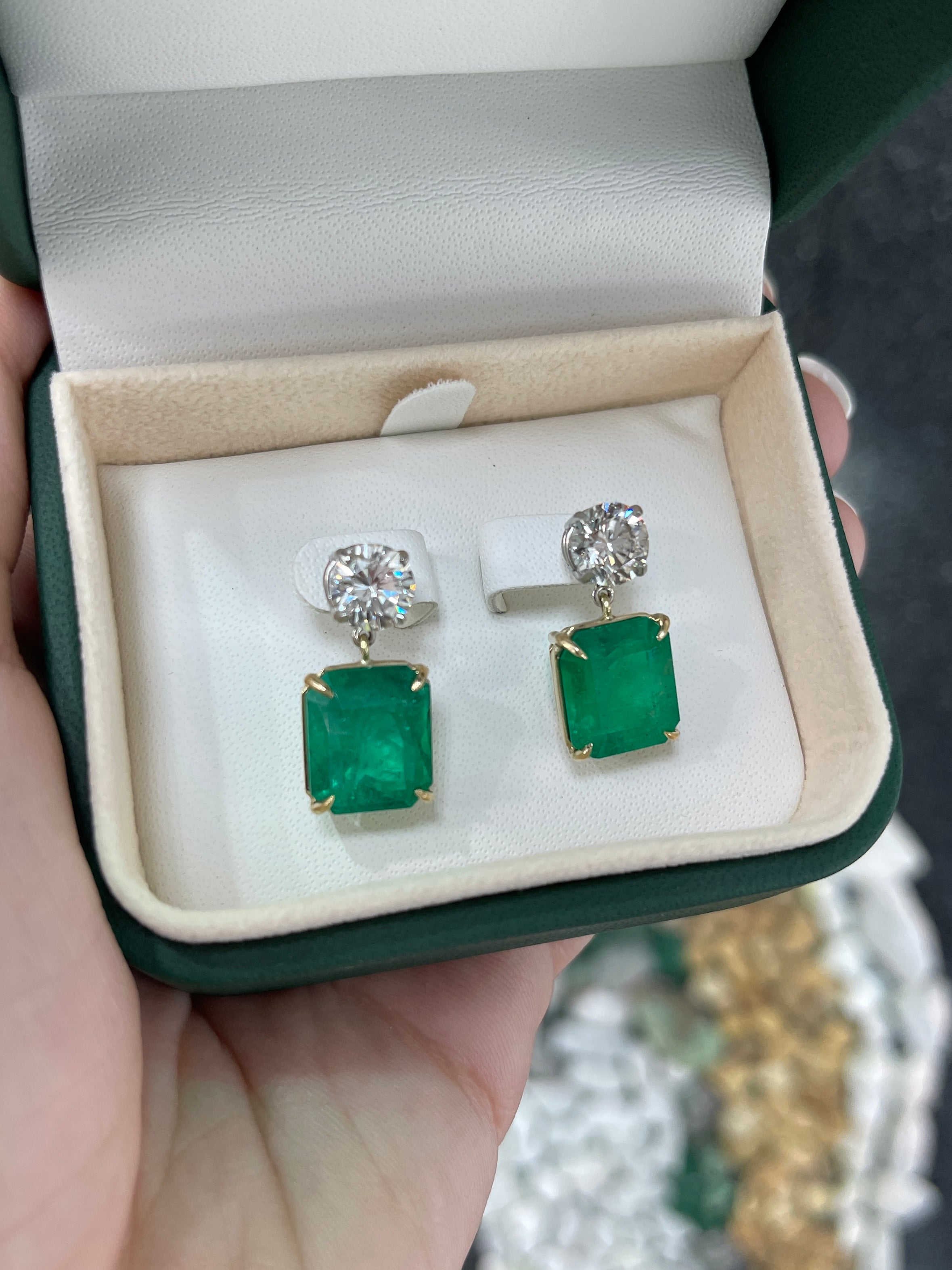 JR Colombian Emeralds 17.72tcw AAA+ emerald and diamond dangle earrings in 18K gold and platinum with intricate design.