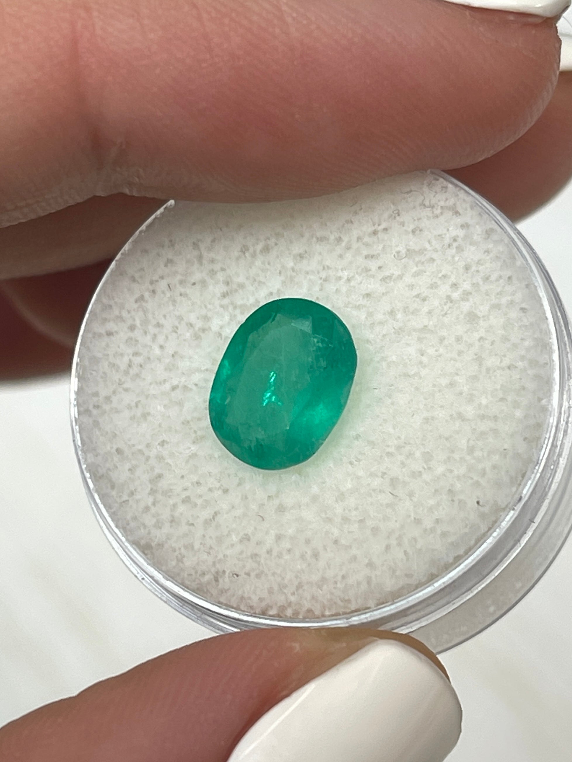 Medium bluish green 2.11 carat oval cut Colombian emerald, natural loose gemstone from JR Colombian Emeralds.
