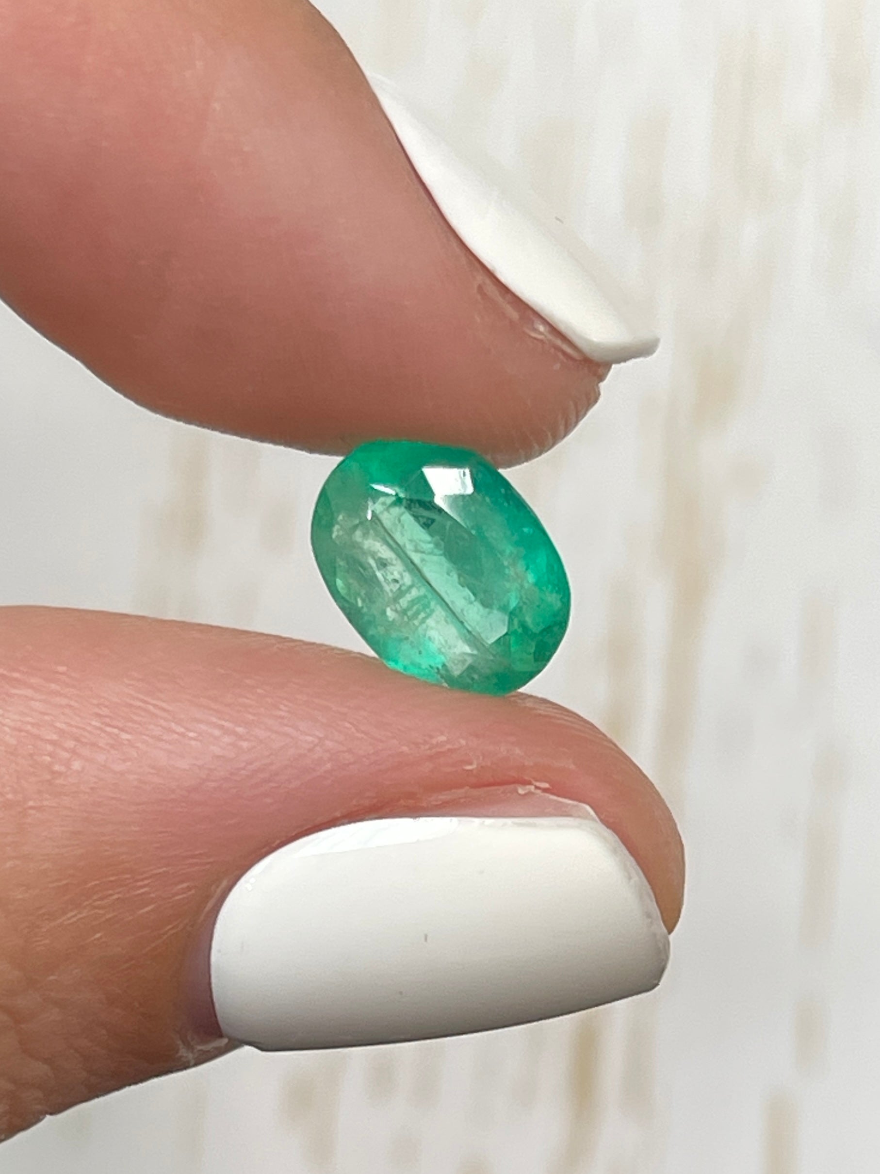 Natural 2.19 carat oval cut Colombian emerald loose gemstone in vibrant green from JR Colombian Emeralds.