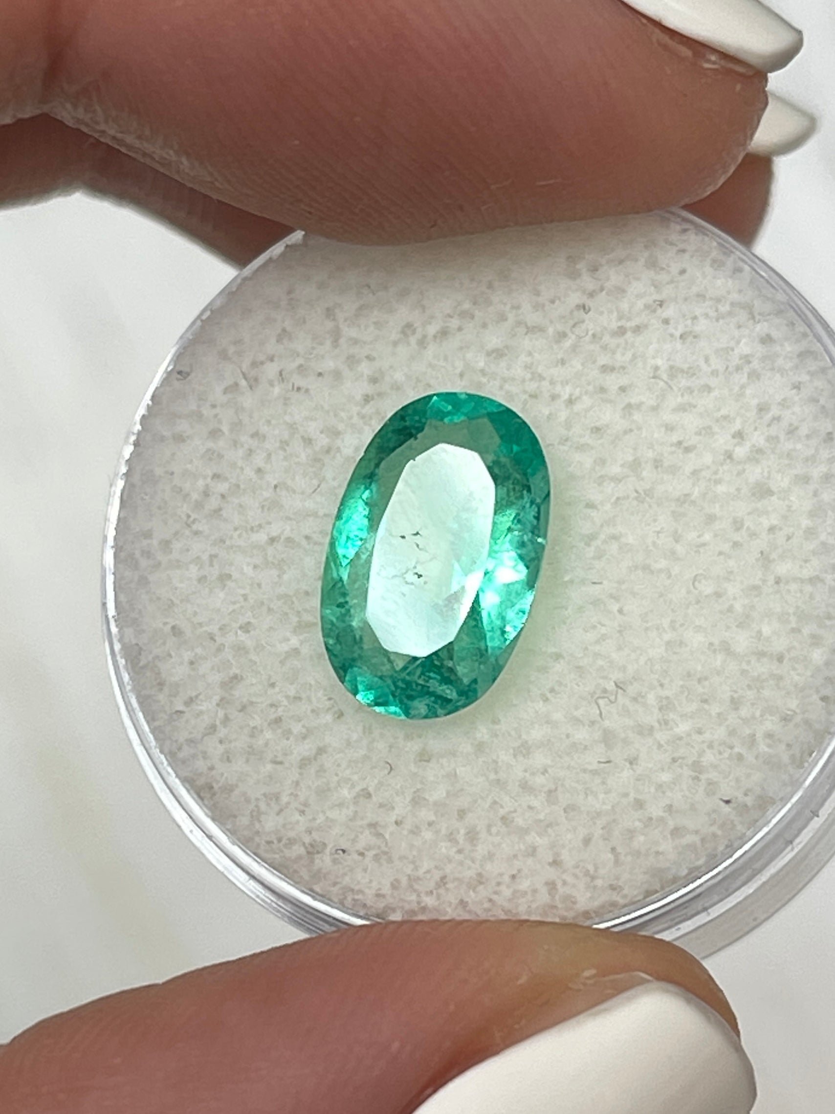 2.31 Carat elongated oval-shaped green Colombian emerald loose gemstone from JR Colombian Emeralds, natural and uncut.