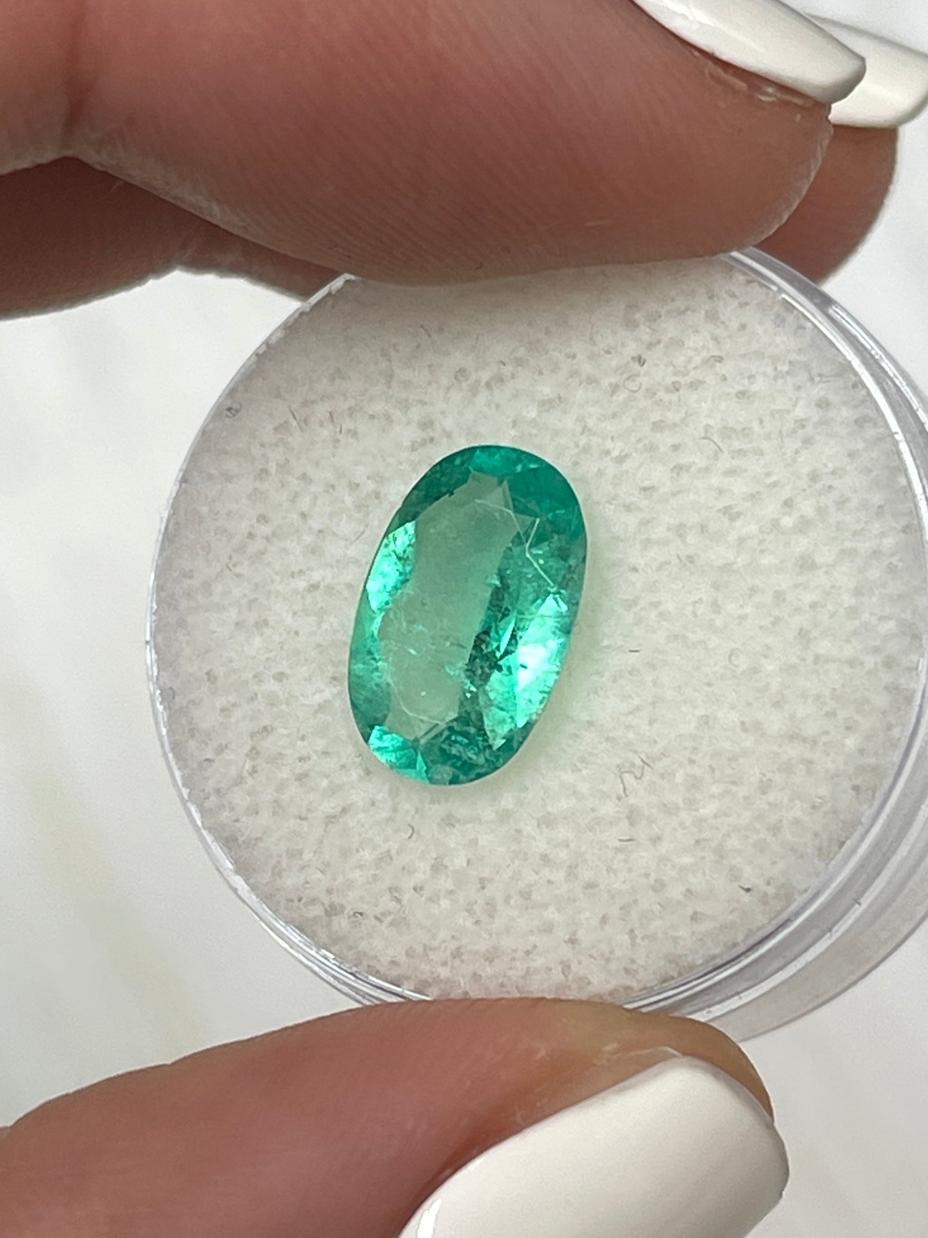2.31 carat elongated oval green Colombian Emerald loose gemstone from JR Colombian Emeralds, natural and vibrant in color.