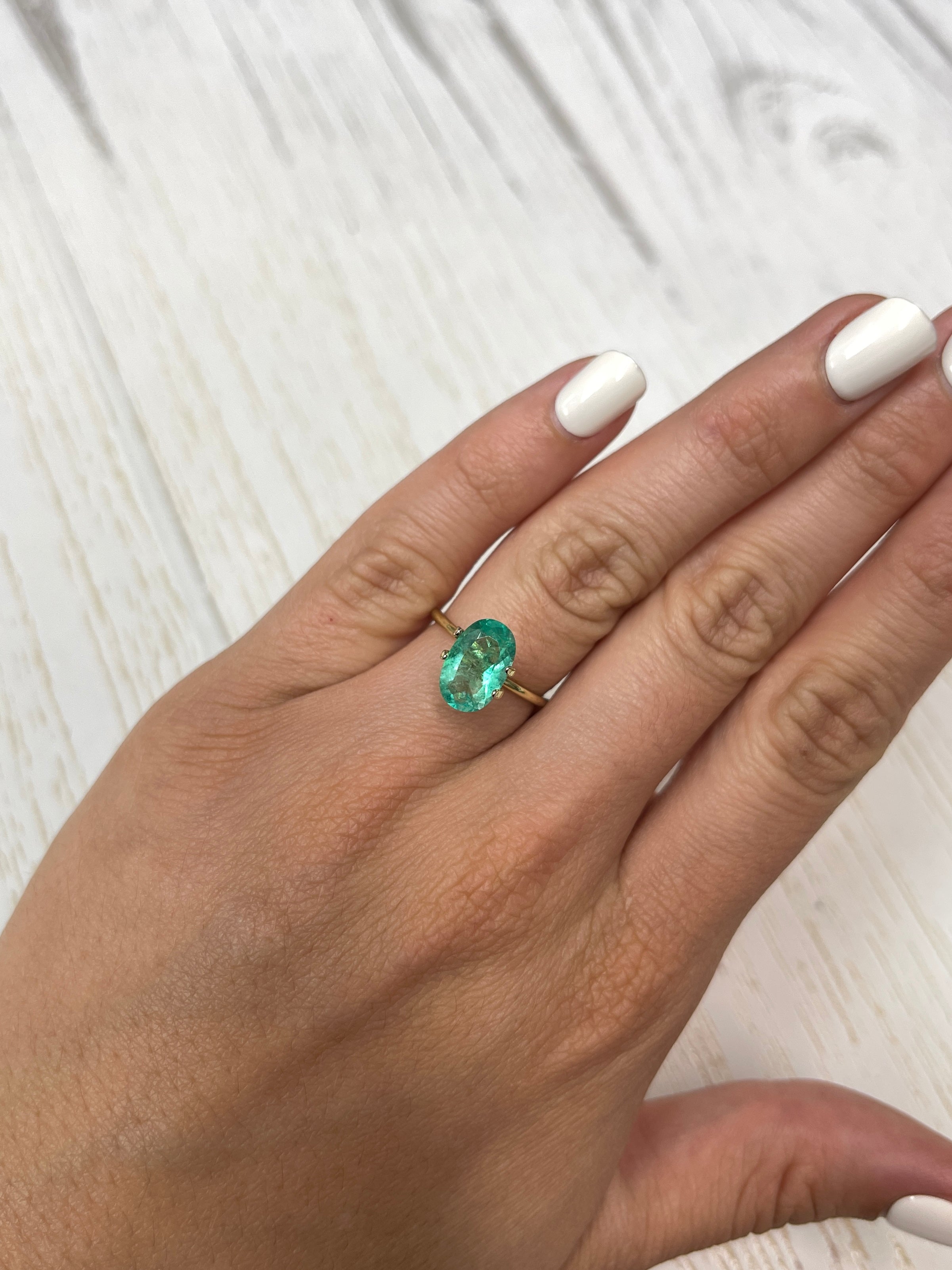 2.31 Carat elongated green Colombian emerald loose stone with oval cut, natural and vibrant, from JR Colombian Emeralds.