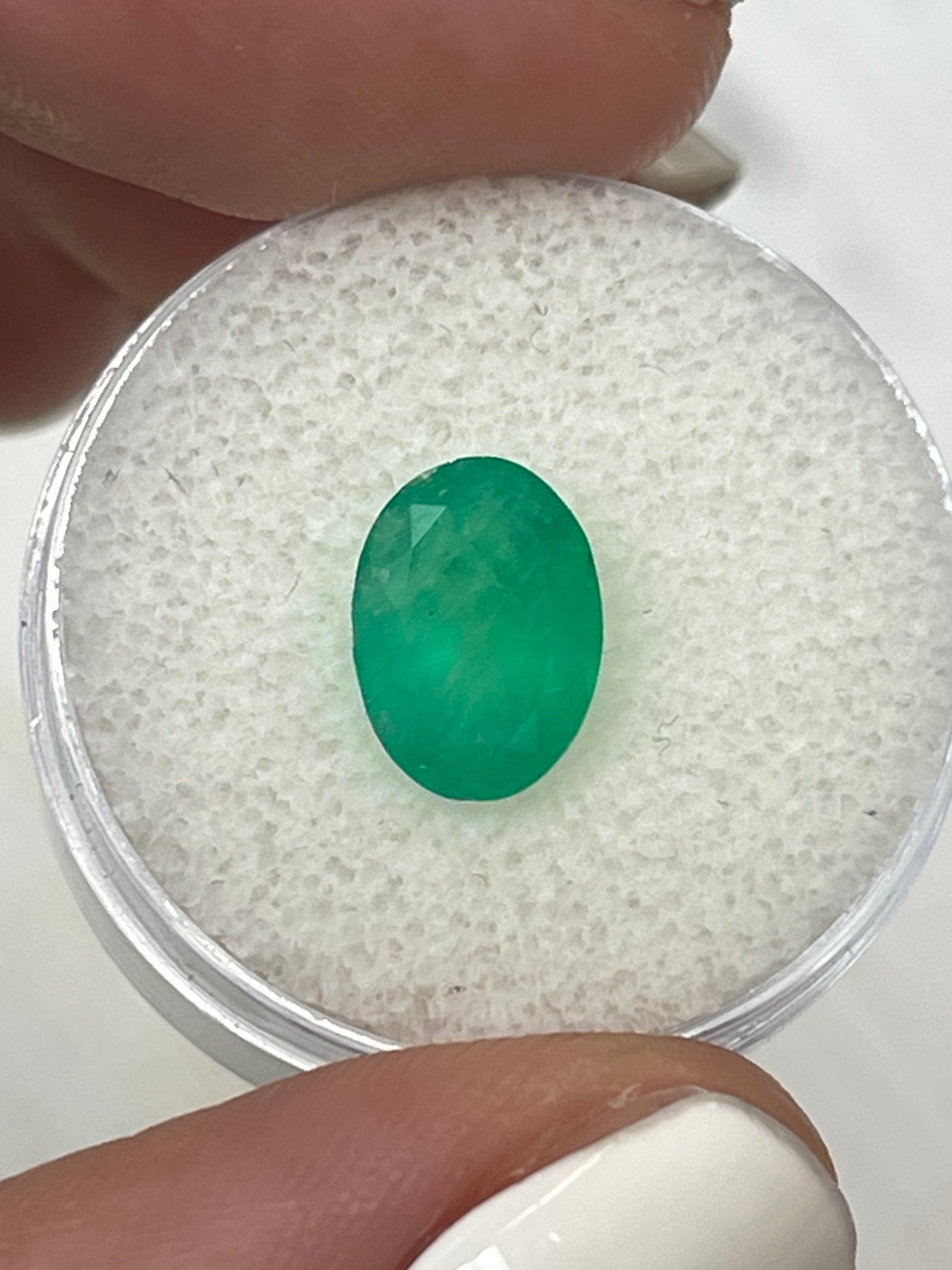 Medium forest green 2.33 carat oval cut Colombian emerald, natural loose gemstone from JR Colombian Emeralds.