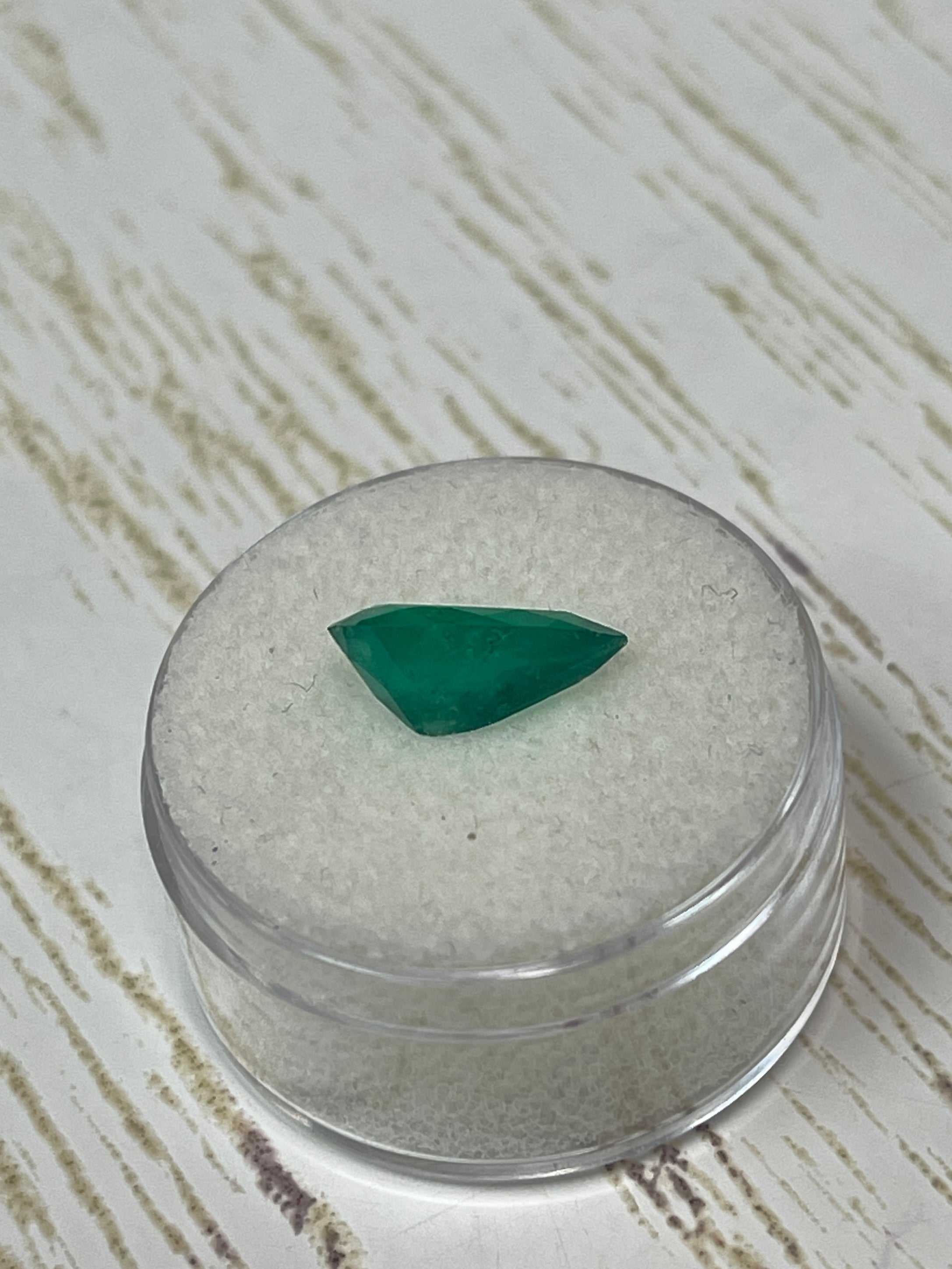 Bright green natural Colombian emerald in pear cut, 2.34 carats, from JR Colombian Emeralds, showcasing its vibrant color and clarity.