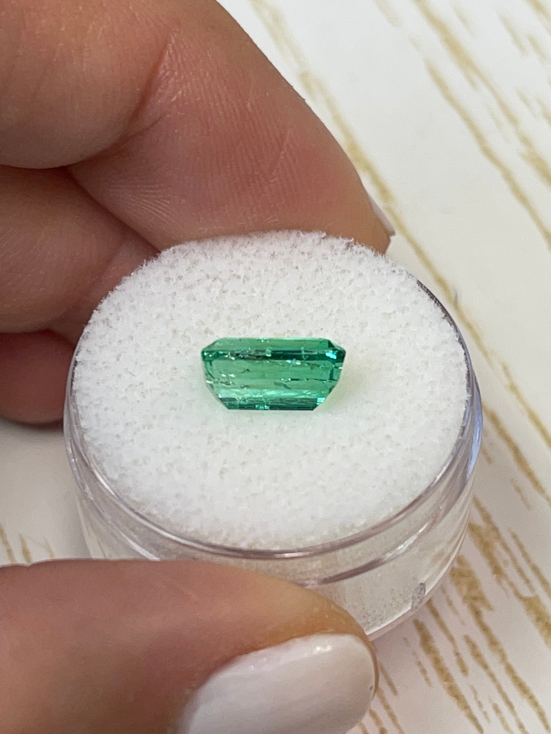 2.38-carat slender Muzo green Colombian emerald cut loose gemstone from JR Colombian Emeralds, showcasing vivid green color and clarity.