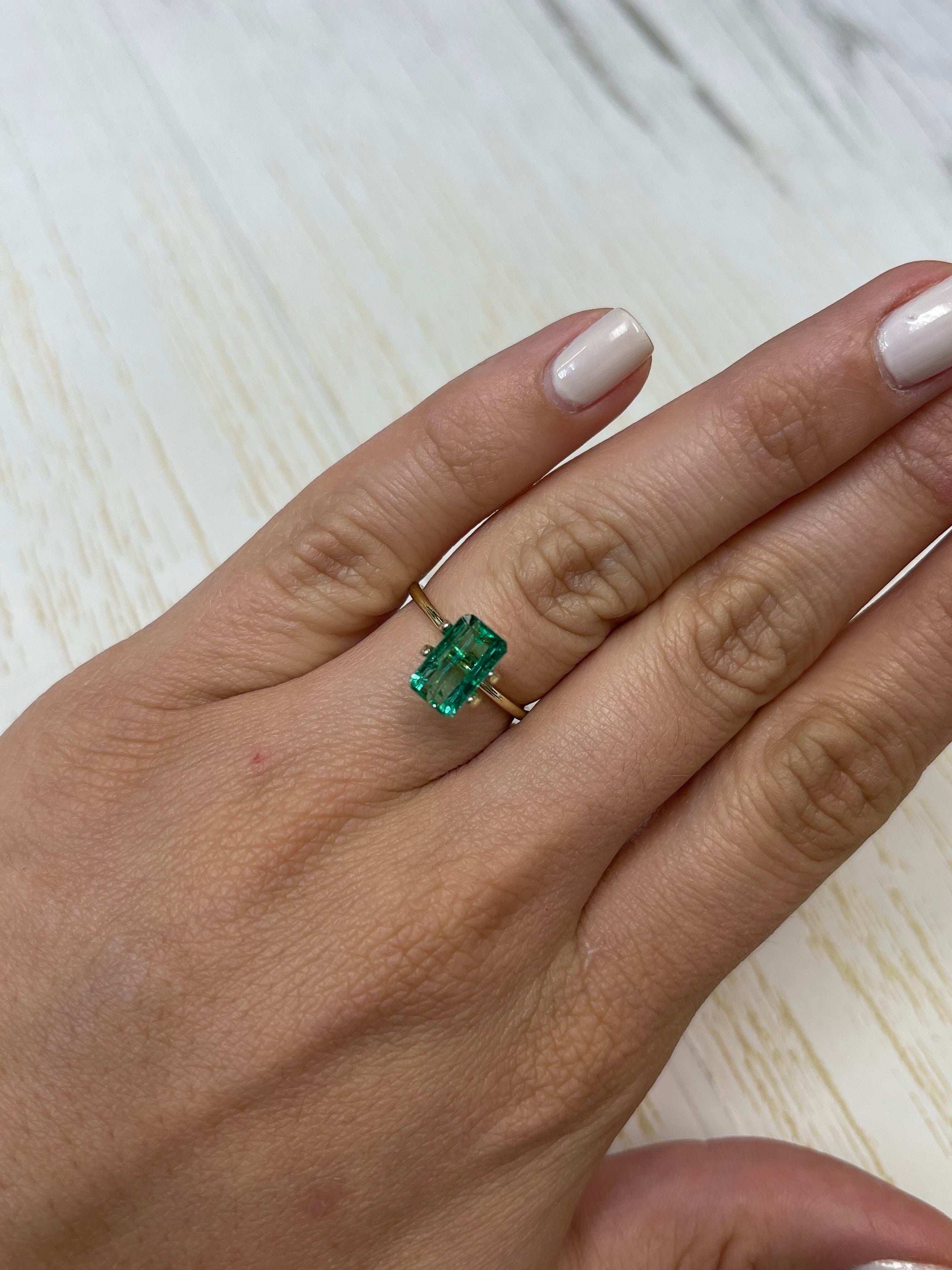 Loose 2.38 carat Muzo green Colombian emerald, emerald cut, slender 10x6 mm from JR Colombian Emeralds.