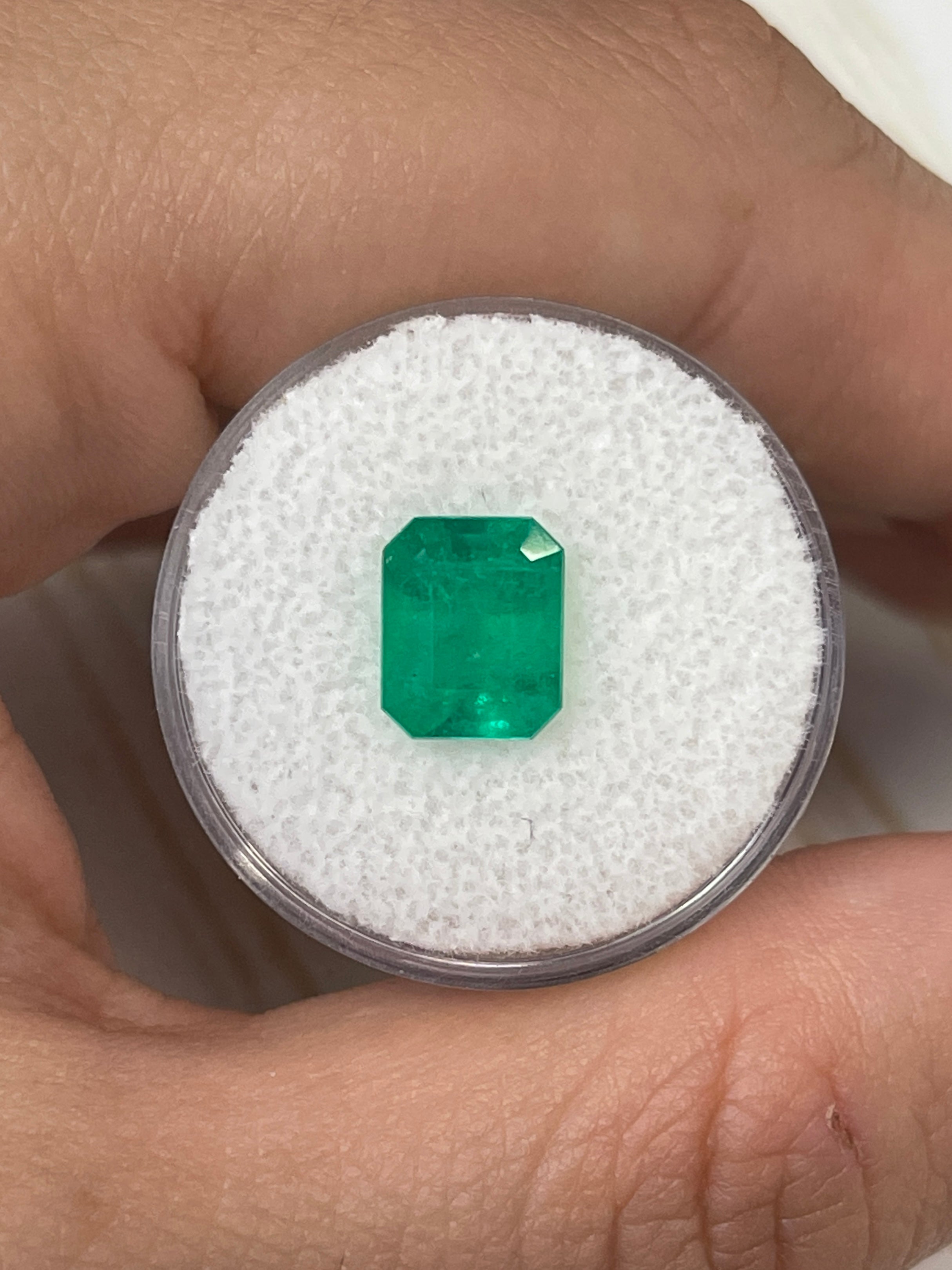 2.52 carat intense green natural Colombian emerald in an emerald cut, displayed as a loose gemstone from JR Colombian Emeralds