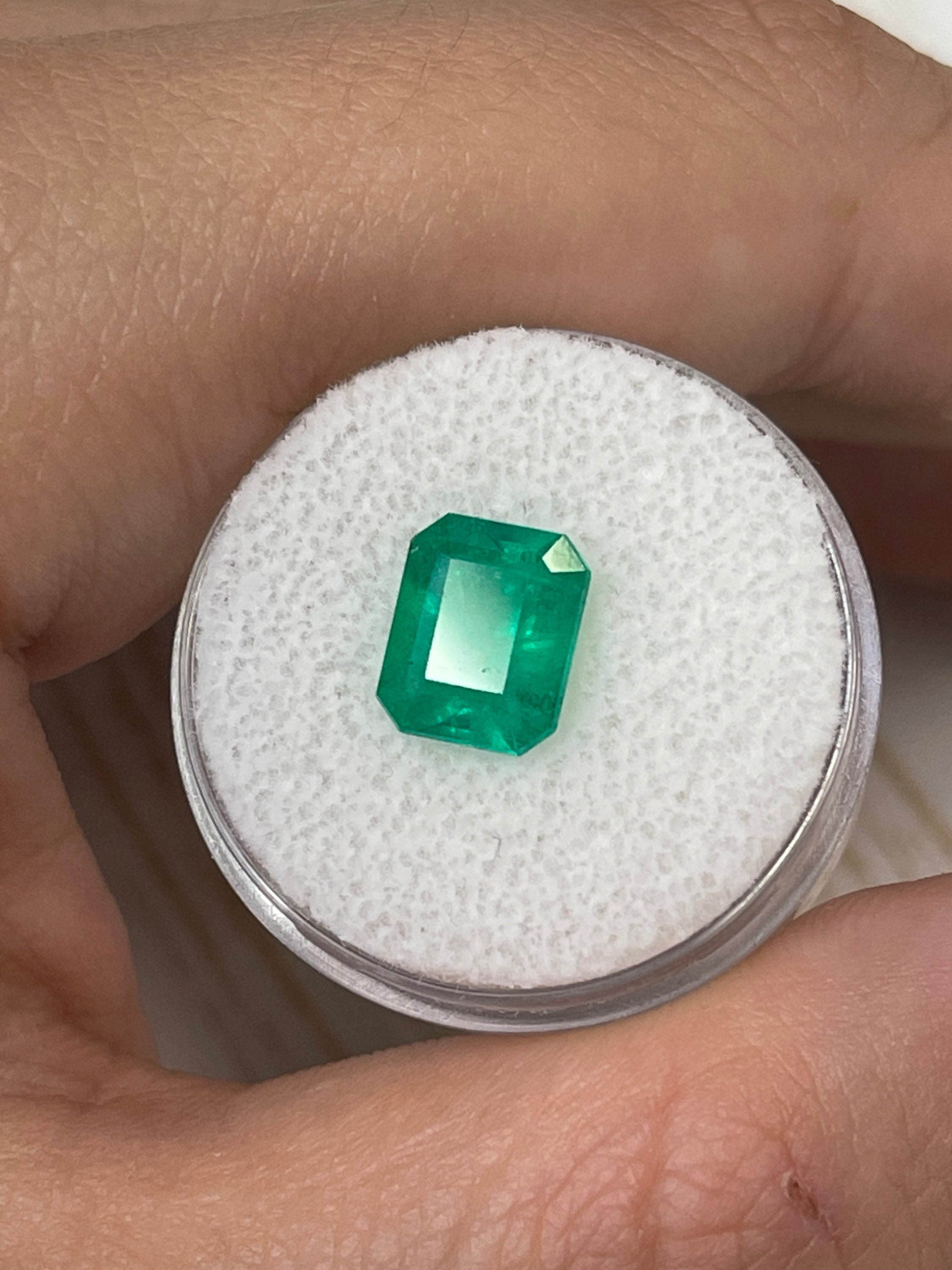 2.52 carat intense green natural Colombian emerald loose gemstone in an emerald cut, showcasing vibrant color and clarity.